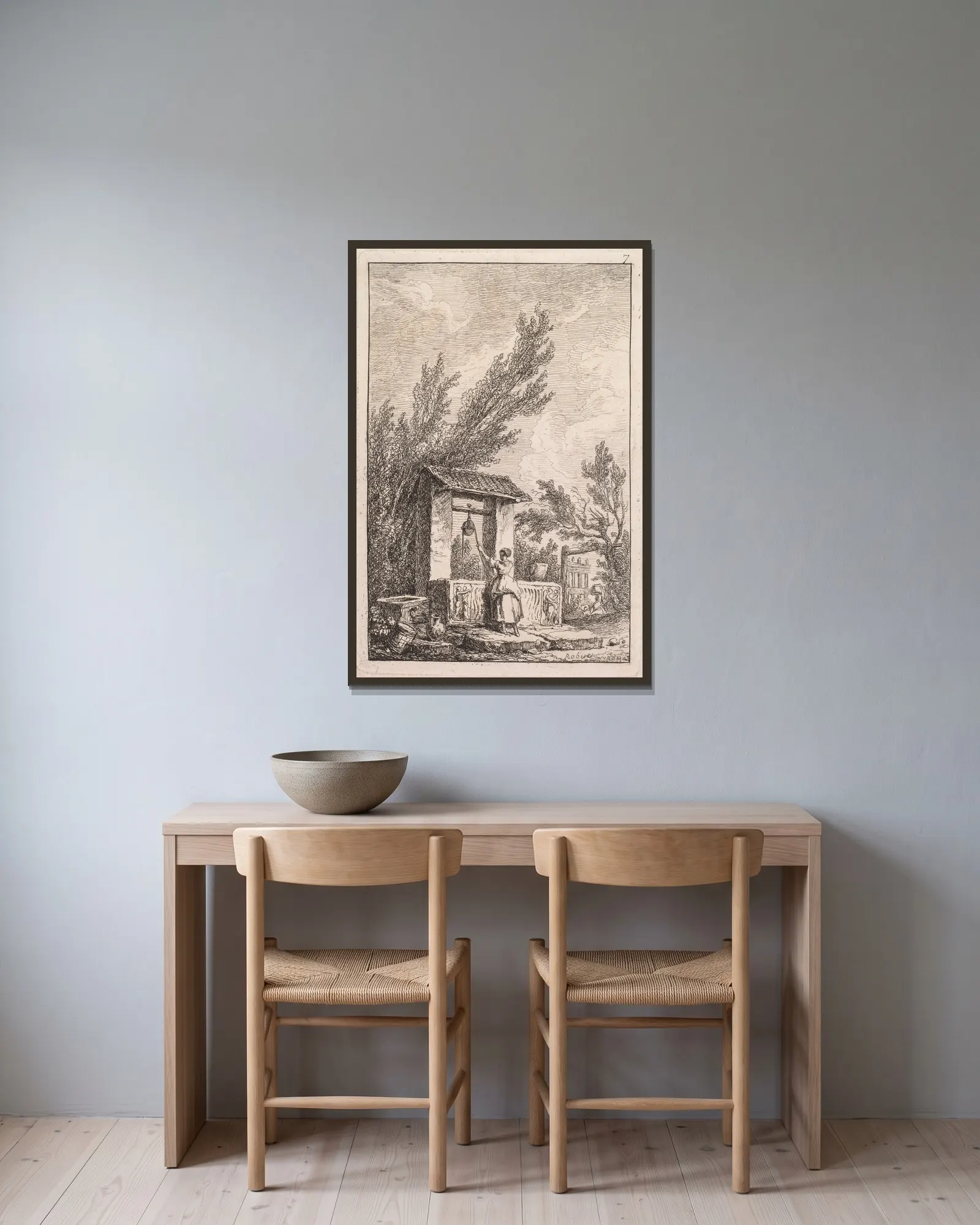 Le Puits av Hubert Robert inramad på en vägg