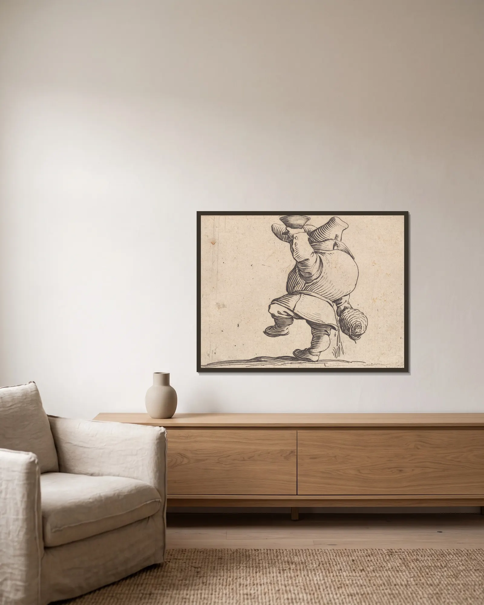 Le buveur vu de dos av Jacques Callot inramad på en vägg