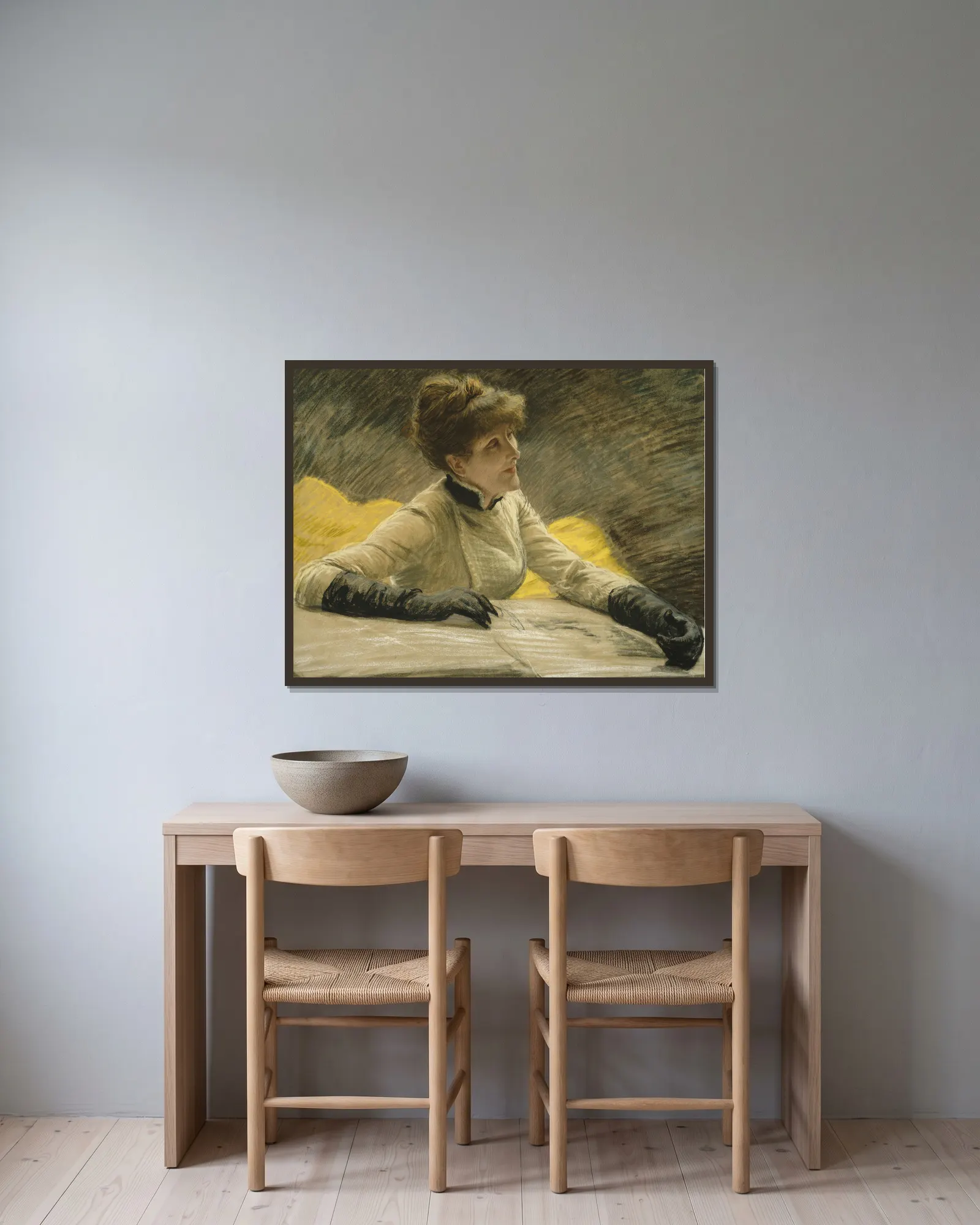 Admiring a Portfolio av James Tissot inramad på en vägg