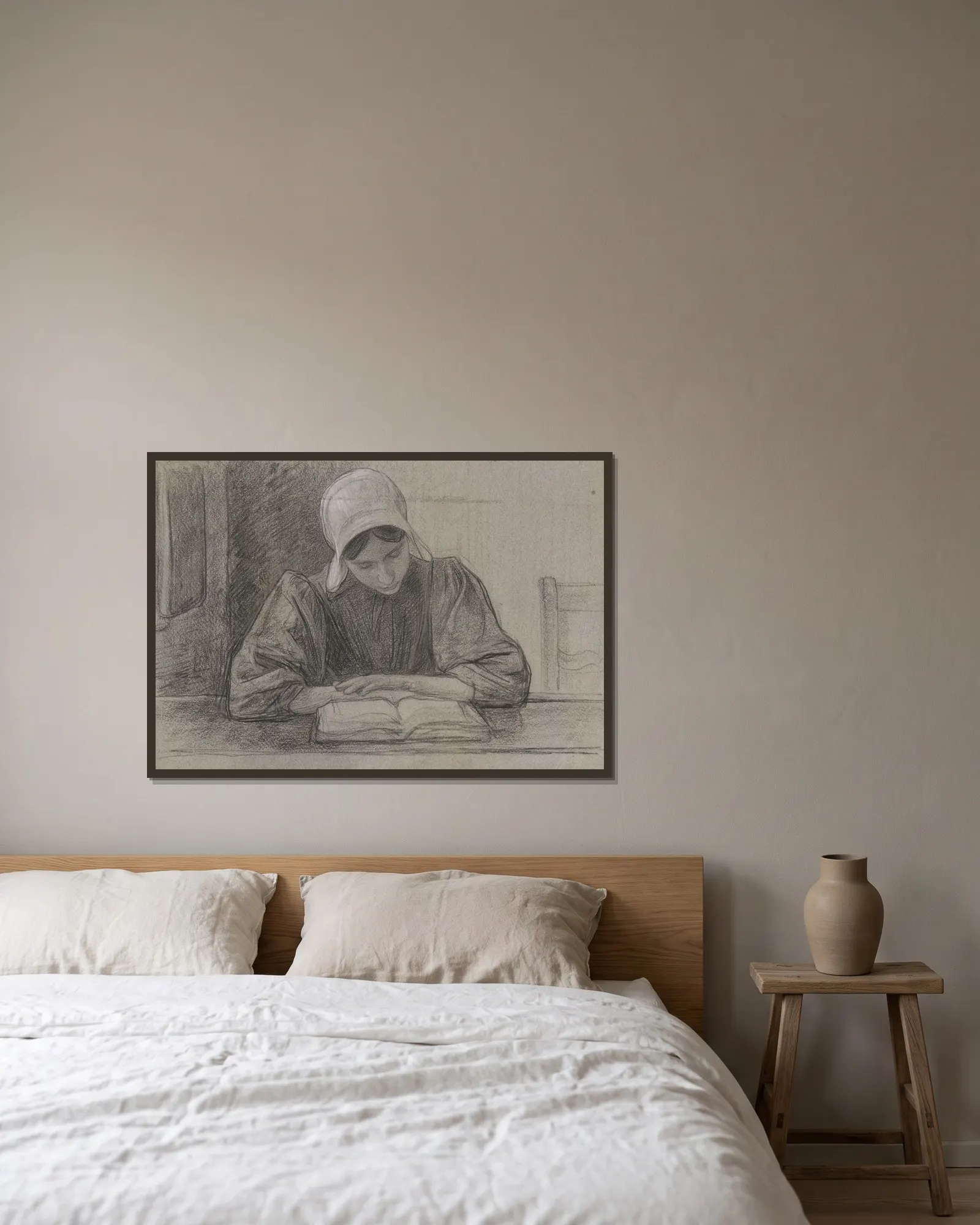 Lezend meisje met kap av Jan Veth inramad på en vägg