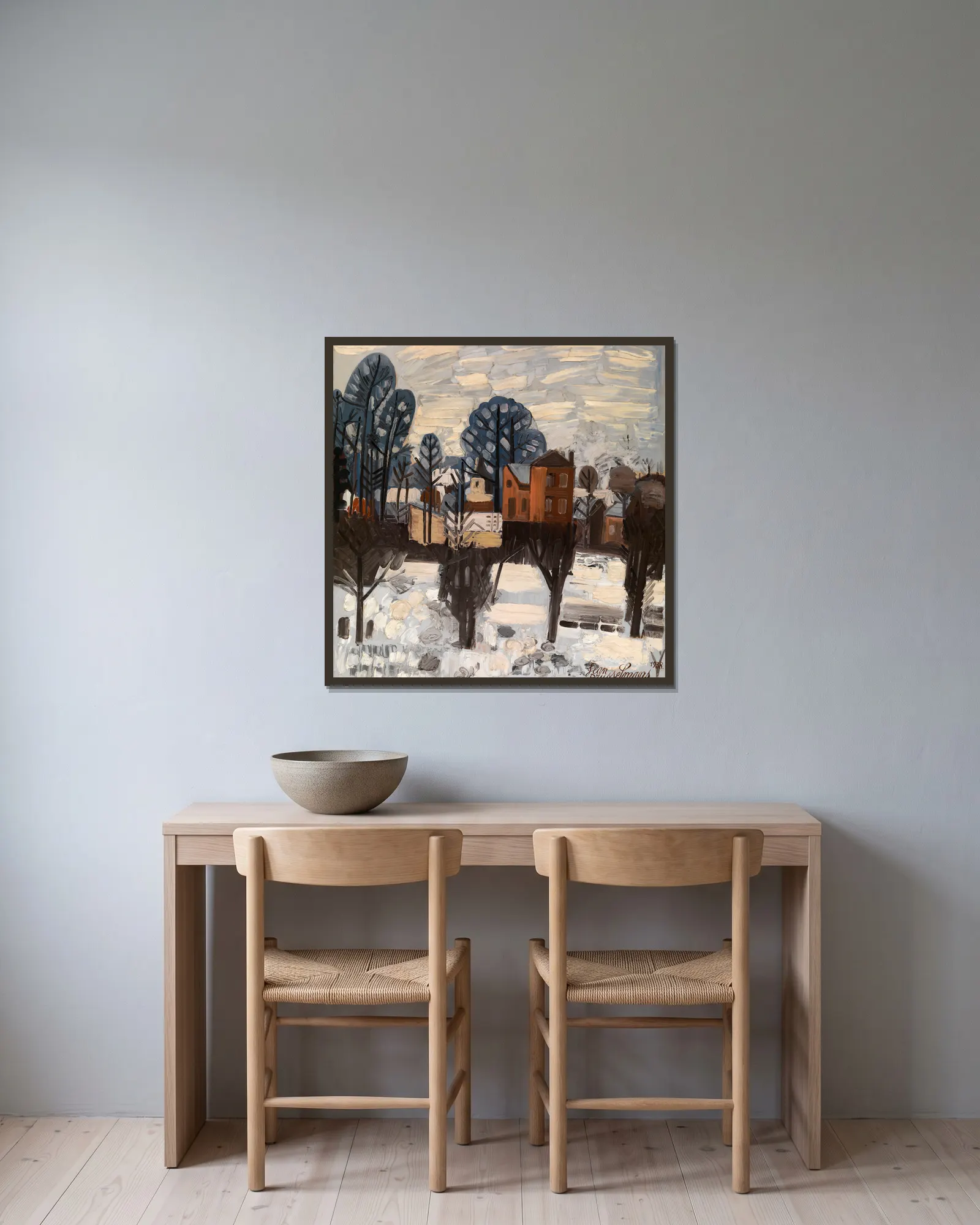 Snowy Landscape av Jean Brusselmans inramad på en vägg