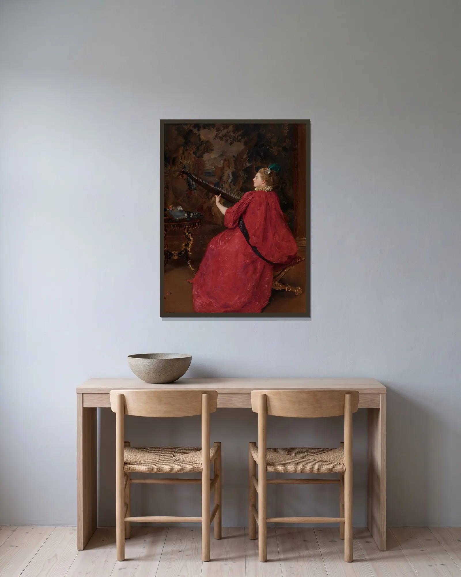 La musicienne av Gustave Jean Jacquet inramad på en vägg