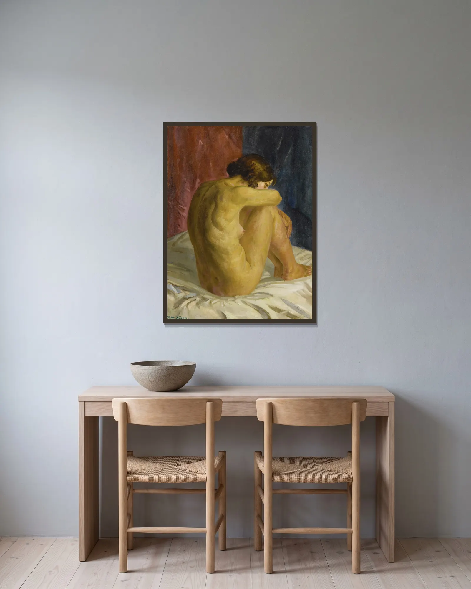 Nude Glancing Back av John Sloan inramad på en vägg