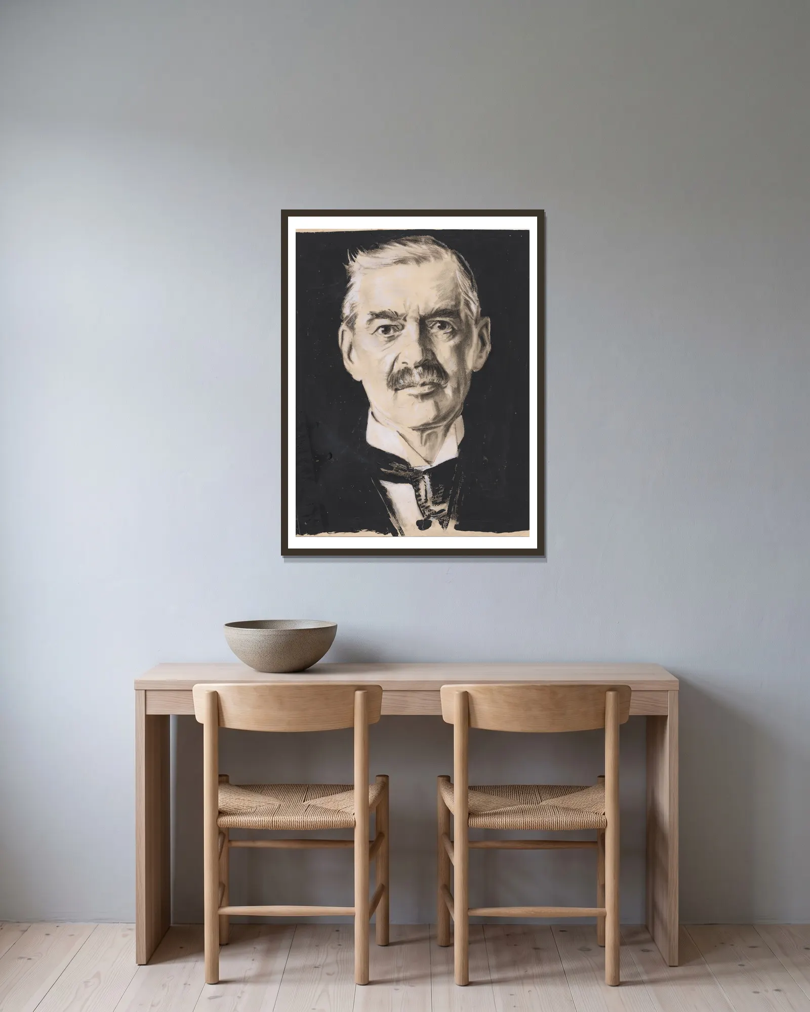 Neville Chamberlain av Samuel Johnson Woolf inramad på en vägg