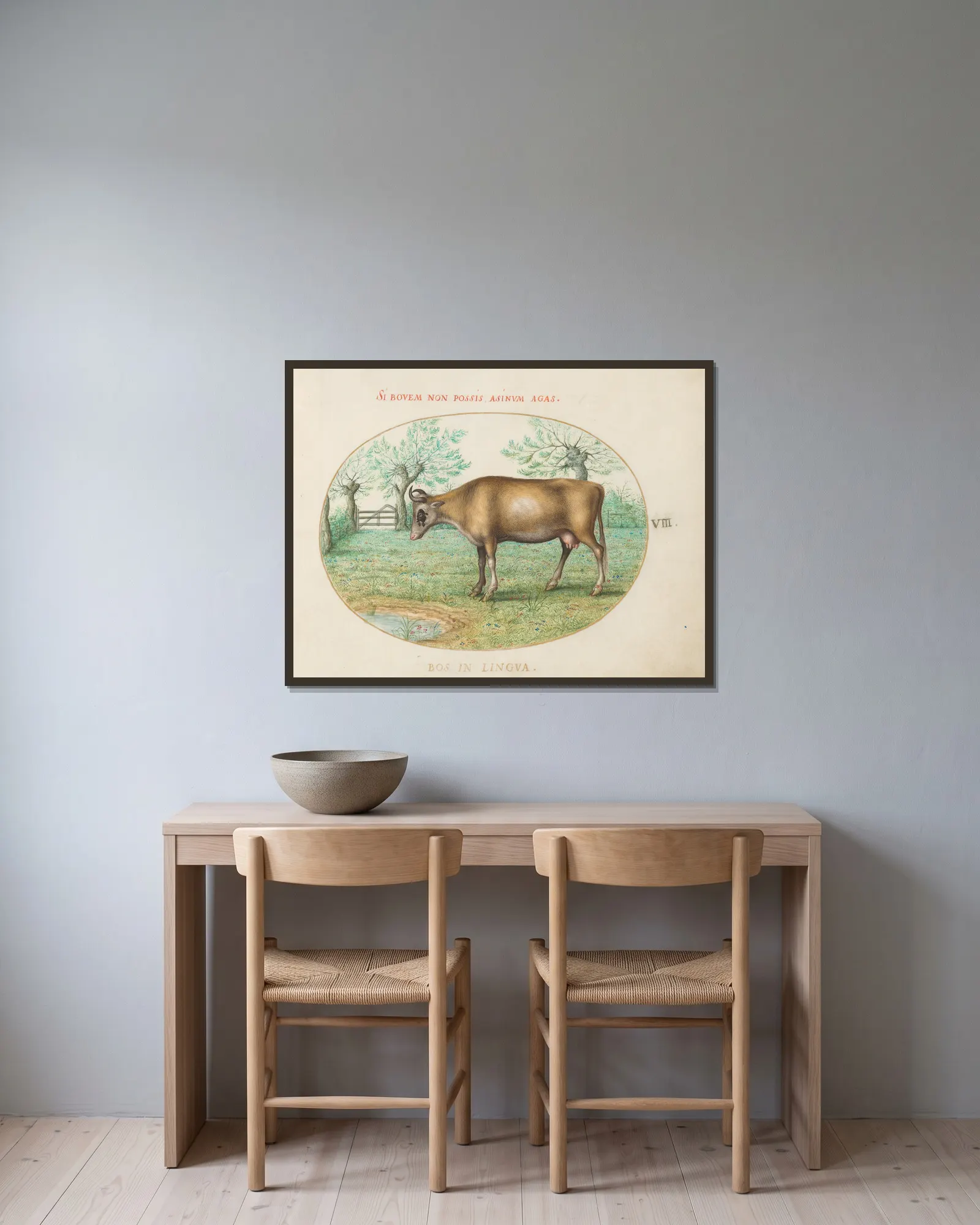 A Cow av Joris Hoefnagel inramad på en vägg