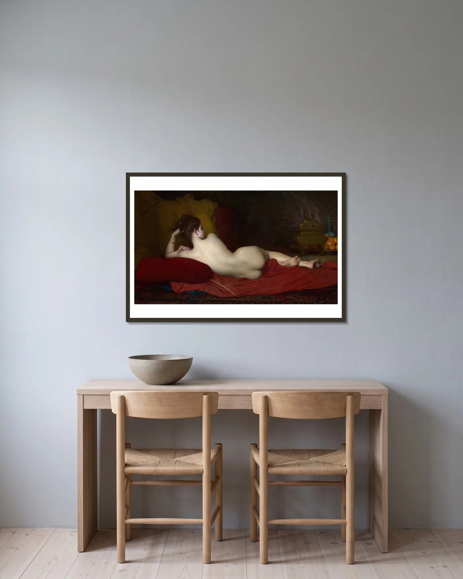 Odalisque av Jules Joseph Lefebvre inramad på en vägg