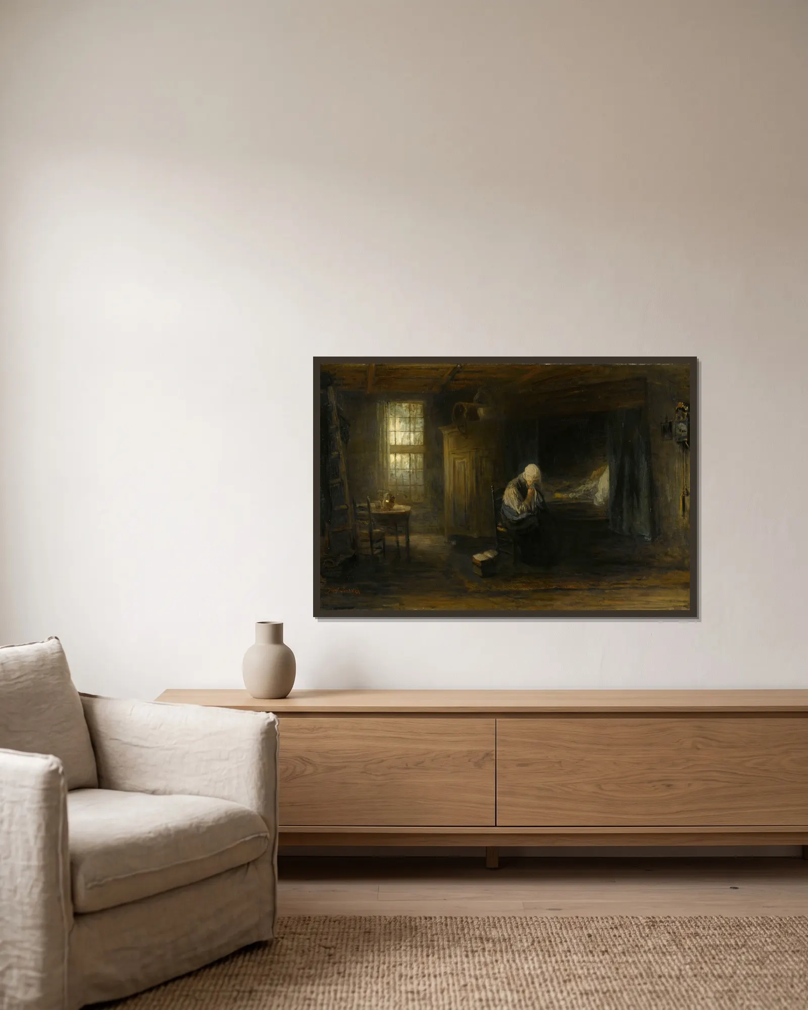 ‘Alone in the World’ av Jozef Israëls inramad på en vägg