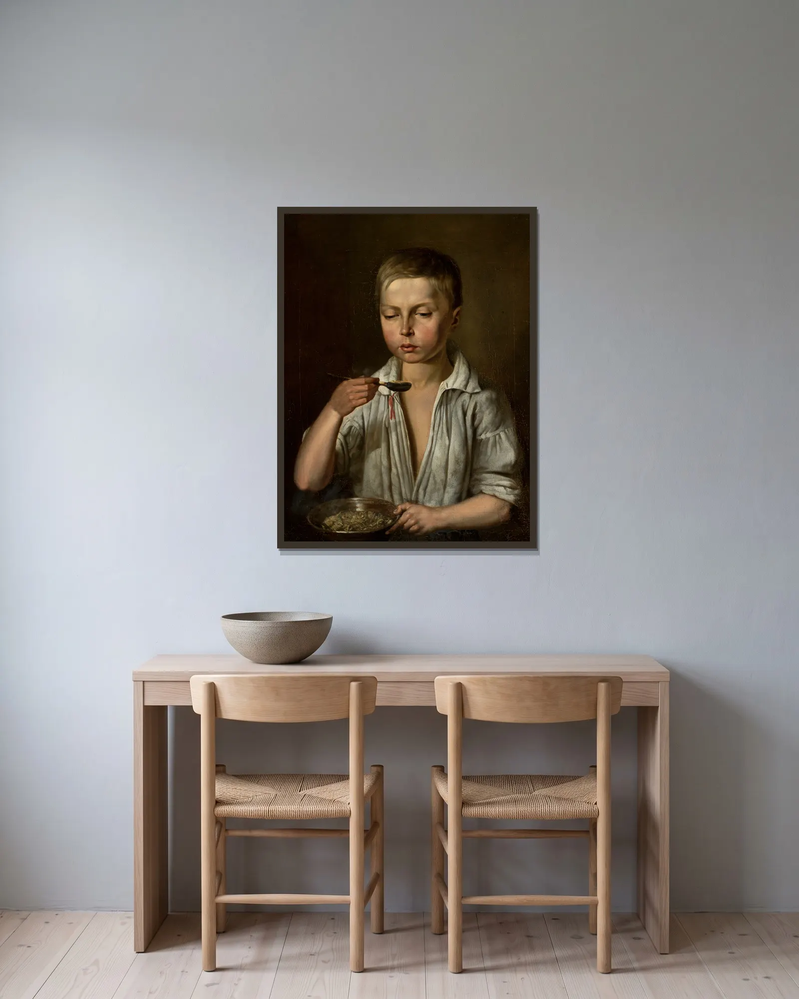 Boy at breakfast av Józef Simmler inramad på en vägg
