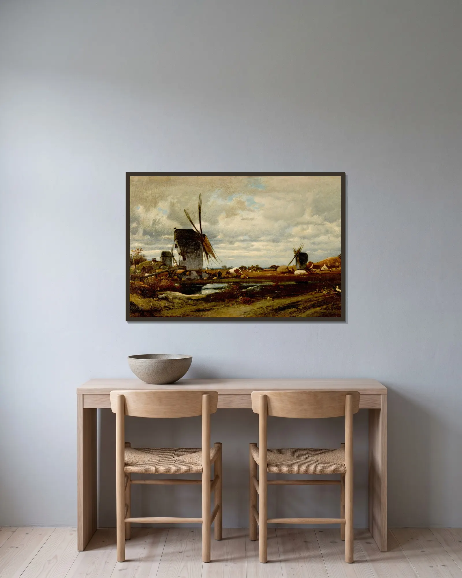 Les moulins à vent av Jules Dupré inramad på en vägg