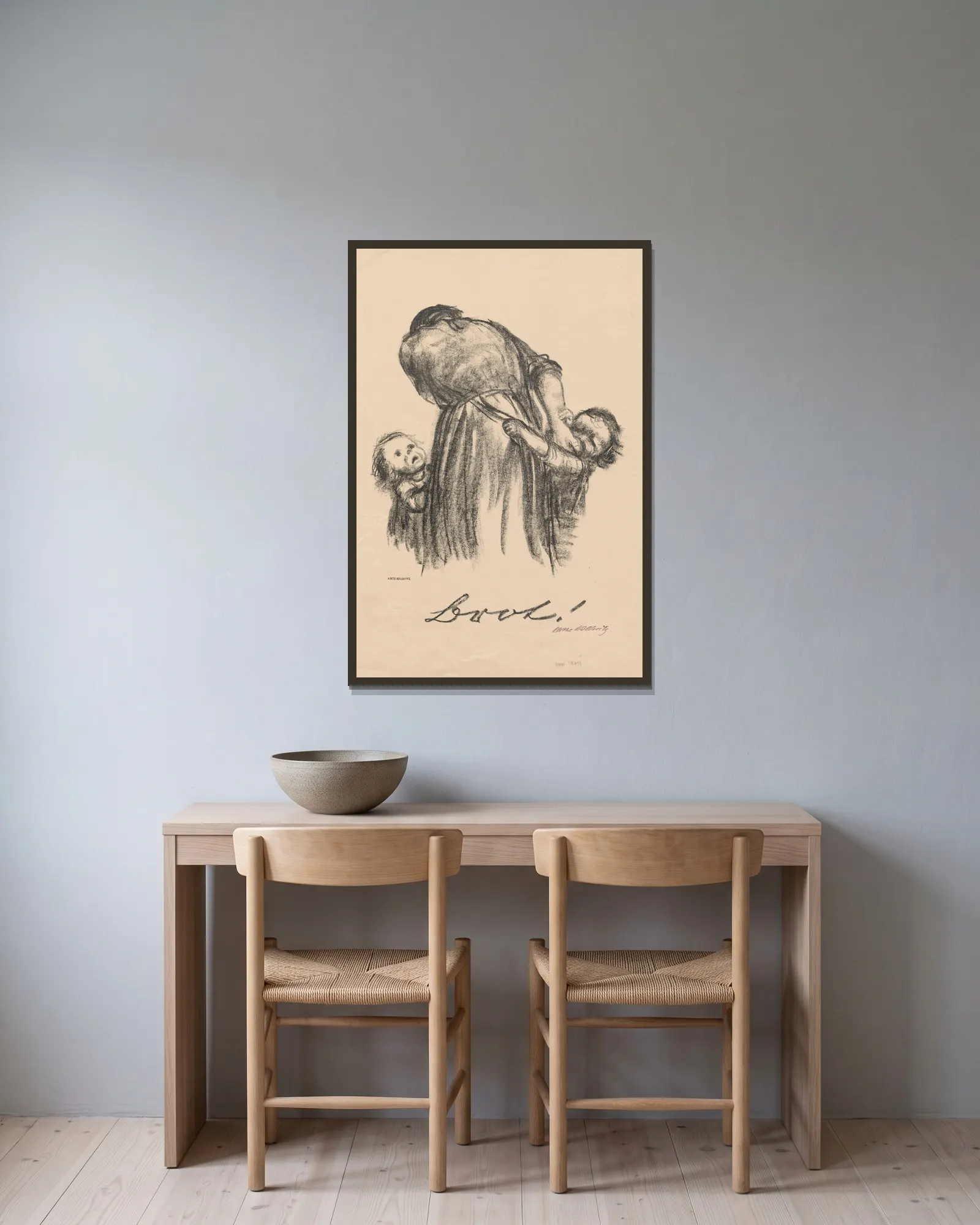 Brot! av Käthe Kollwitz inramad på en vägg