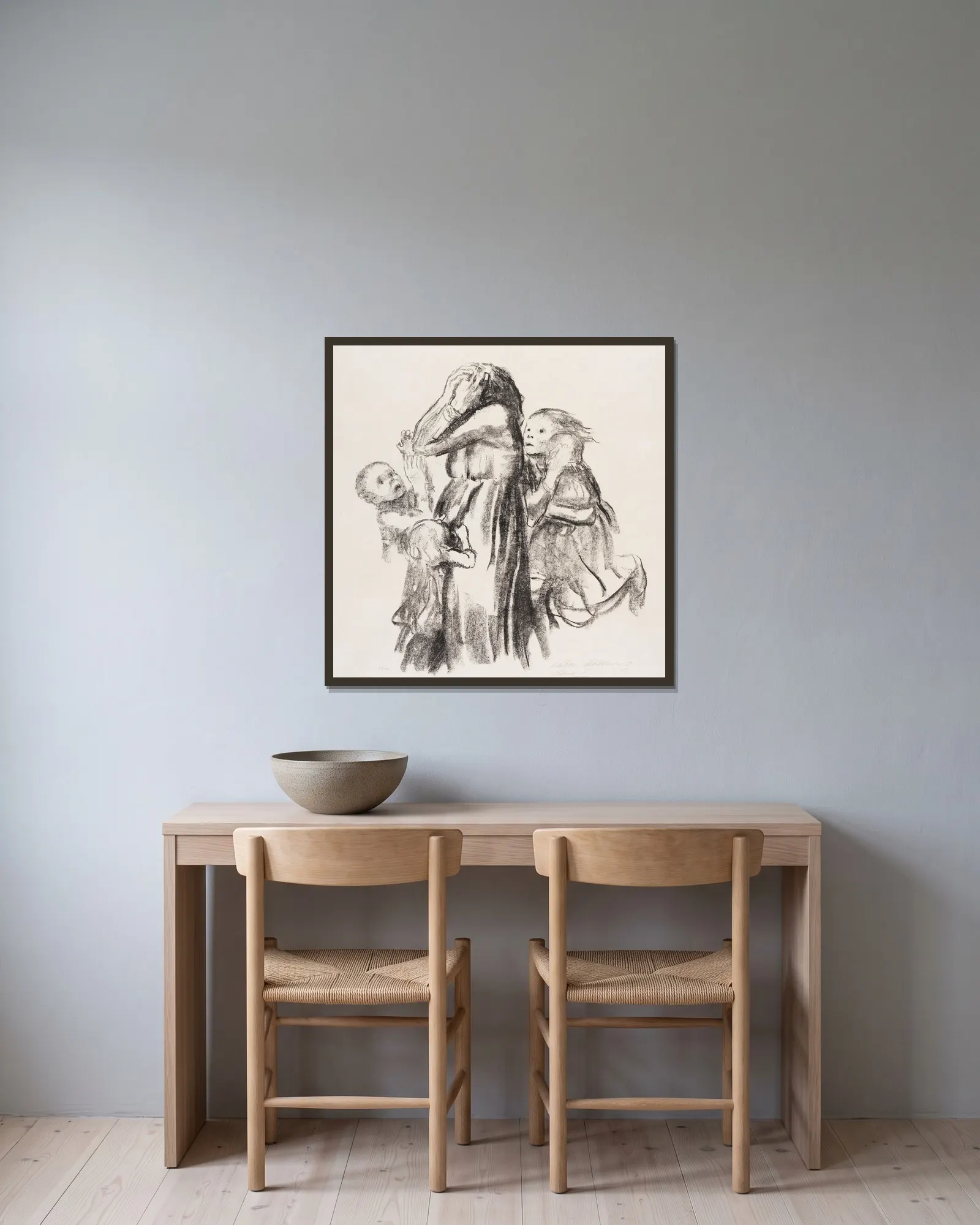 Gefallen av Käthe Kollwitz inramad på en vägg