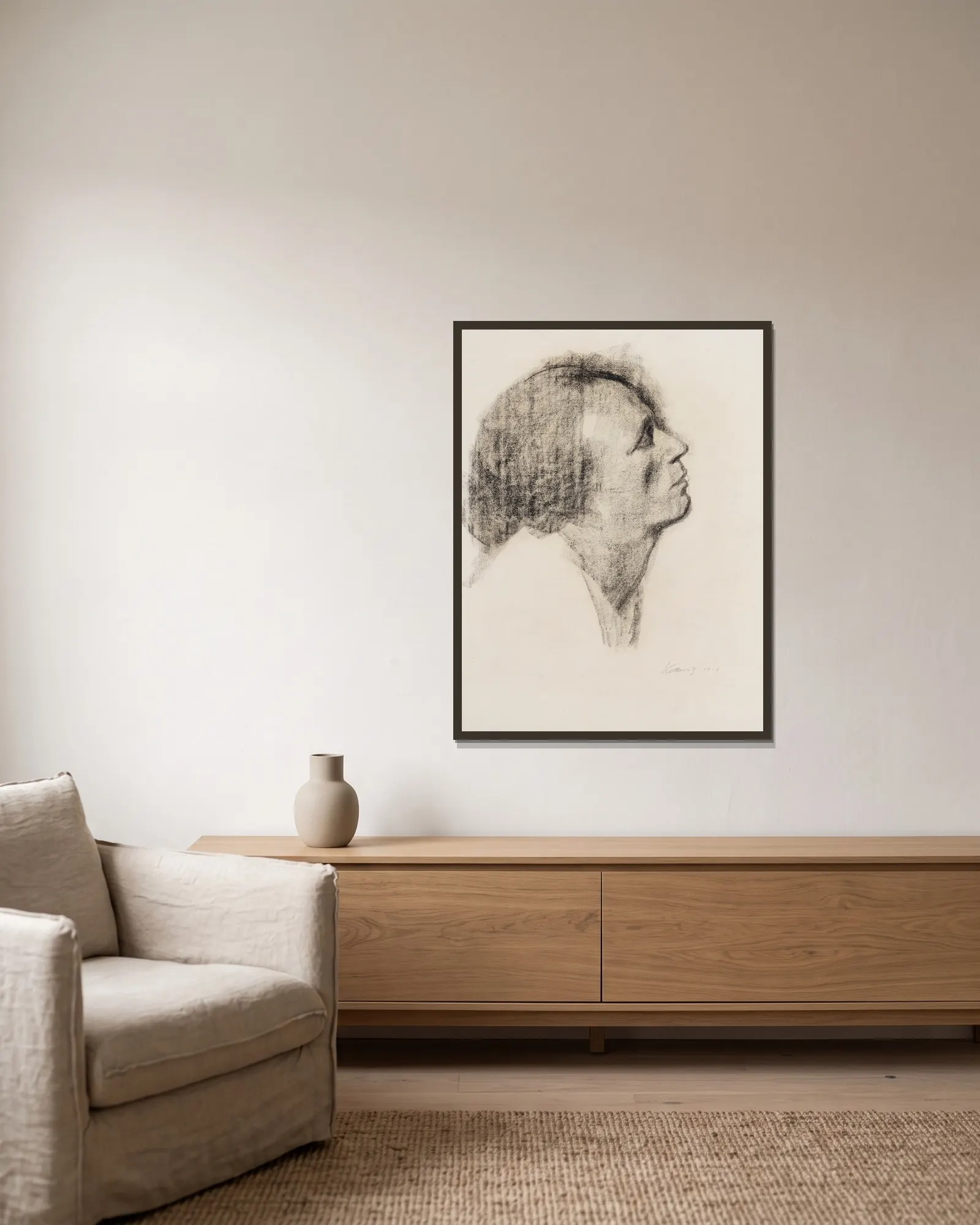 Im Profil av Käthe Kollwitz inramad på en vägg