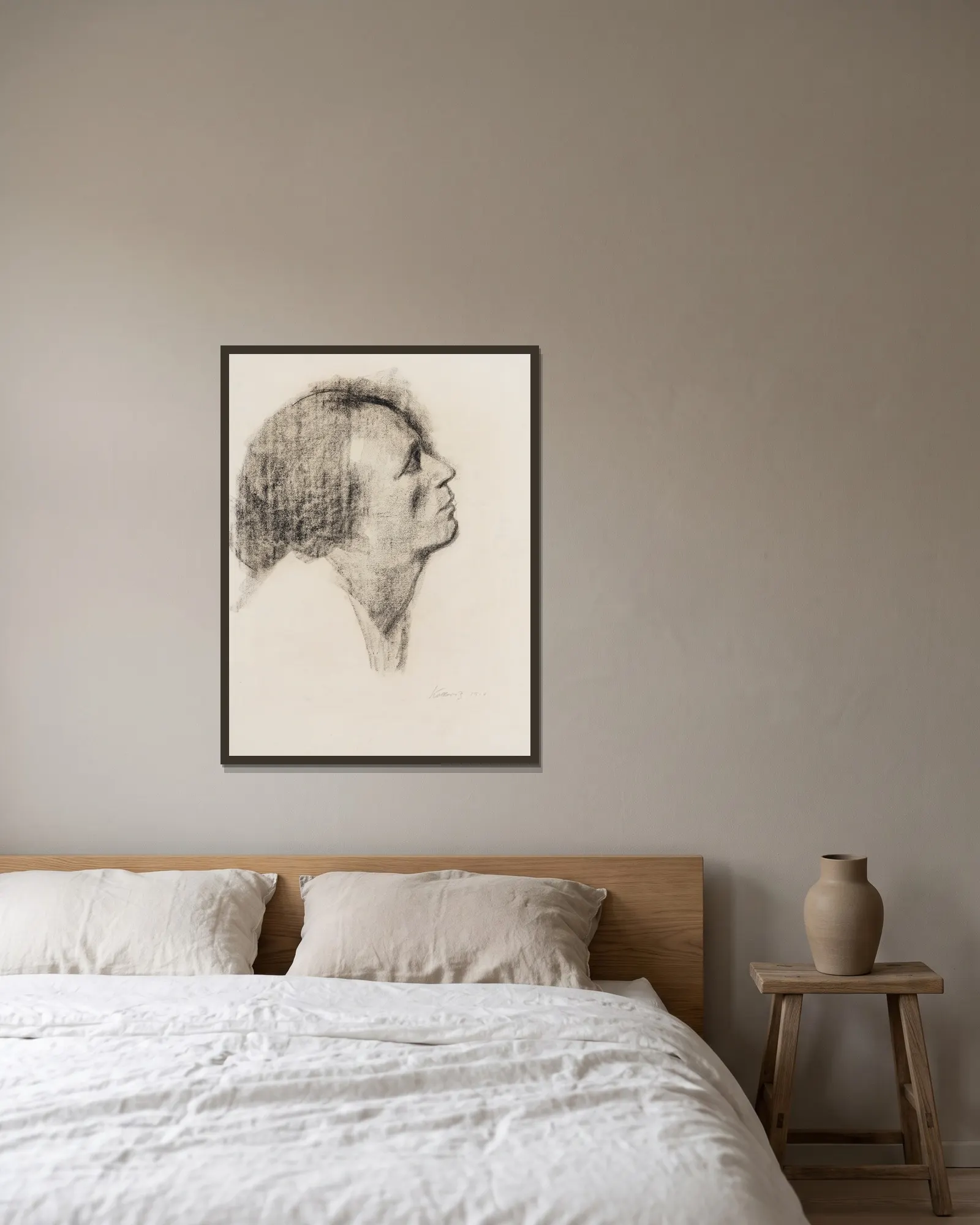 Im Profil av Käthe Kollwitz inramad på en vägg
