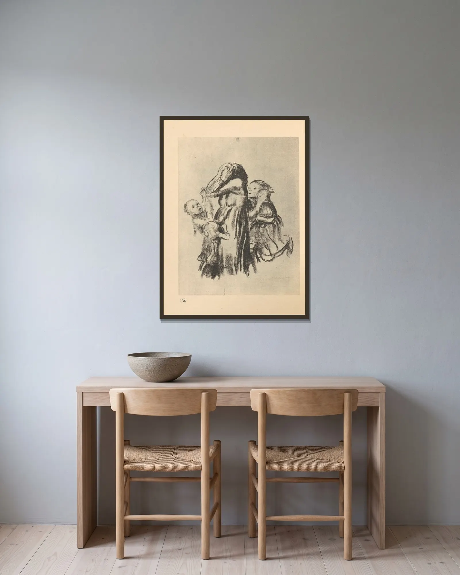 Krieg av Käthe Kollwitz inramad på en vägg