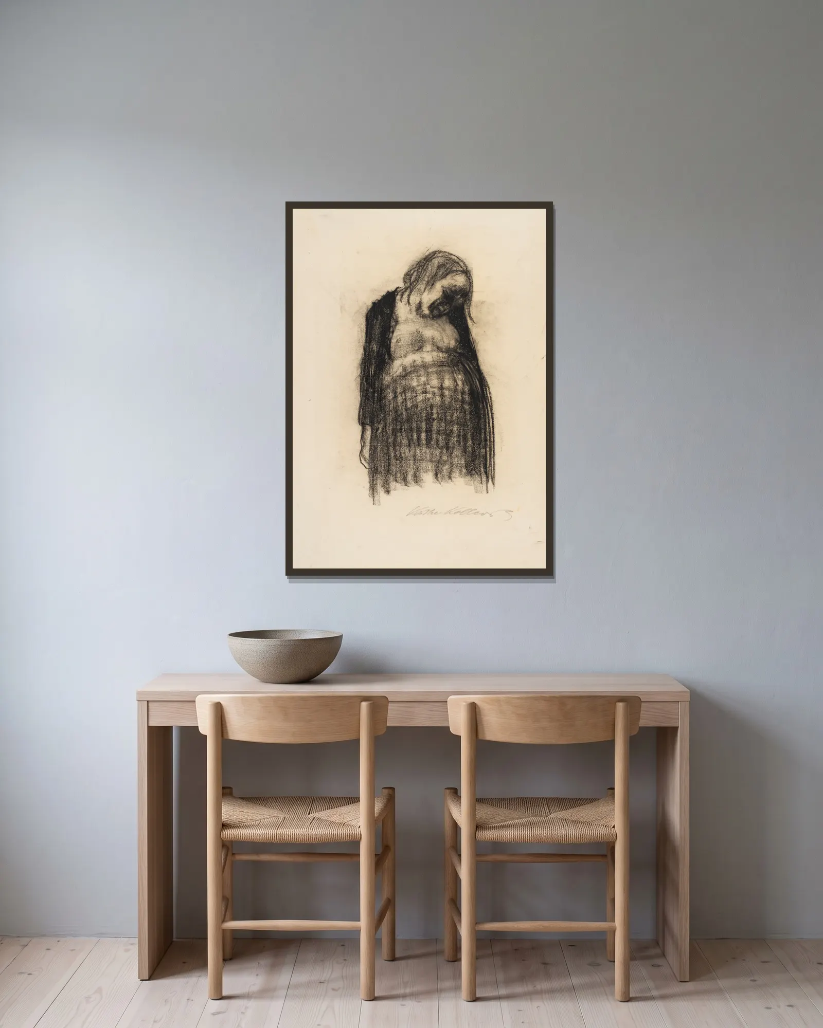 Schwangere av Käthe Kollwitz inramad på en vägg