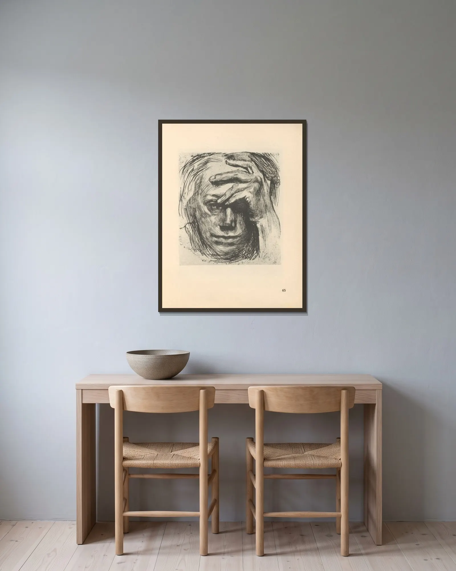 Selbstbildnis, 1925 – nr 1 av Käthe Kollwitz inramad på en vägg