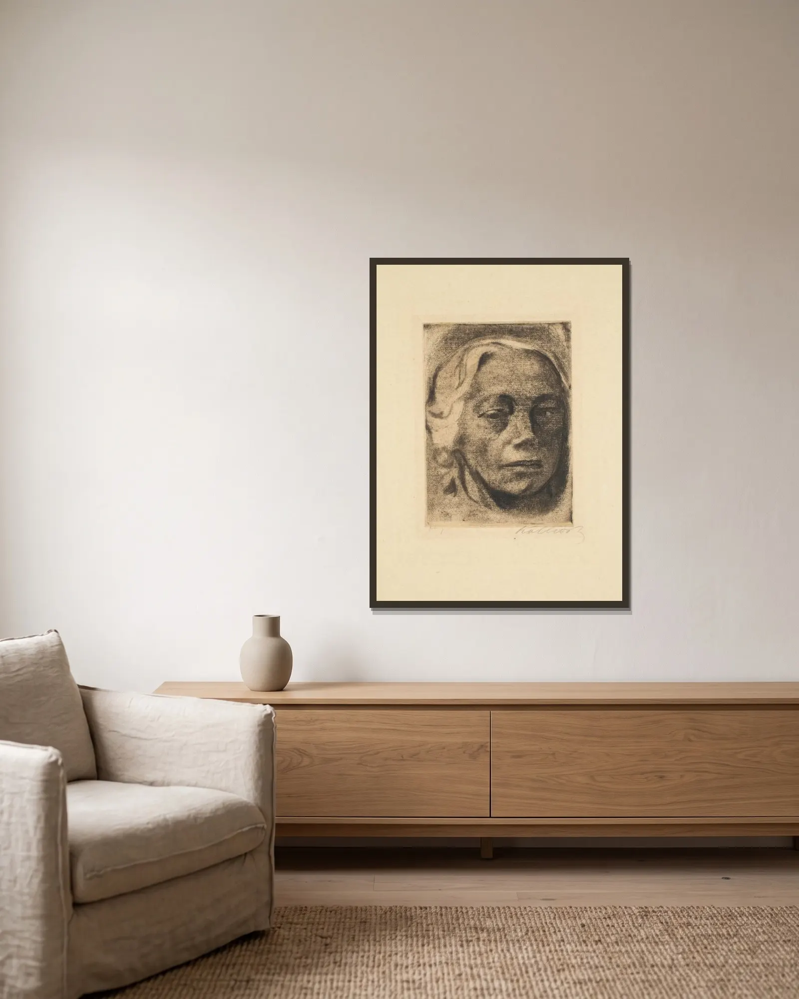 Self Portrait av Käthe Kollwitz inramad på en vägg