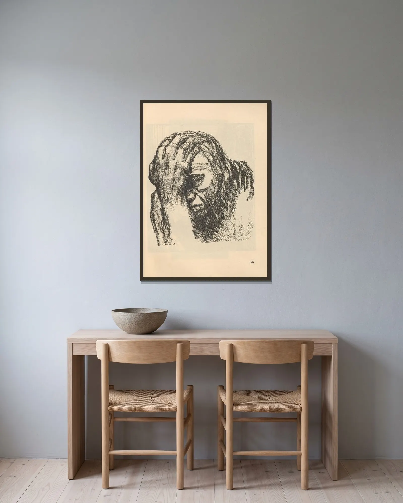 Studie av Käthe Kollwitz inramad på en vägg