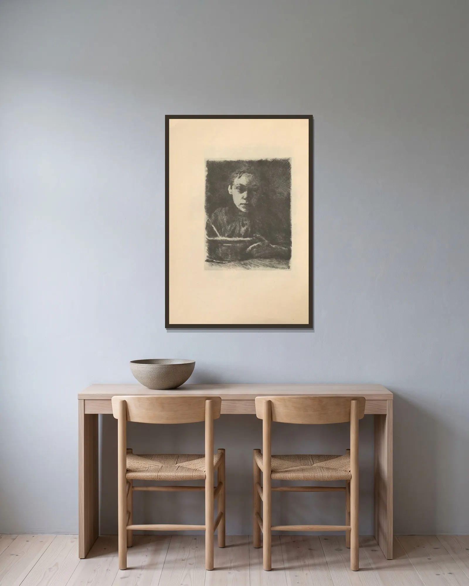 Studien av Käthe Kollwitz inramad på en vägg