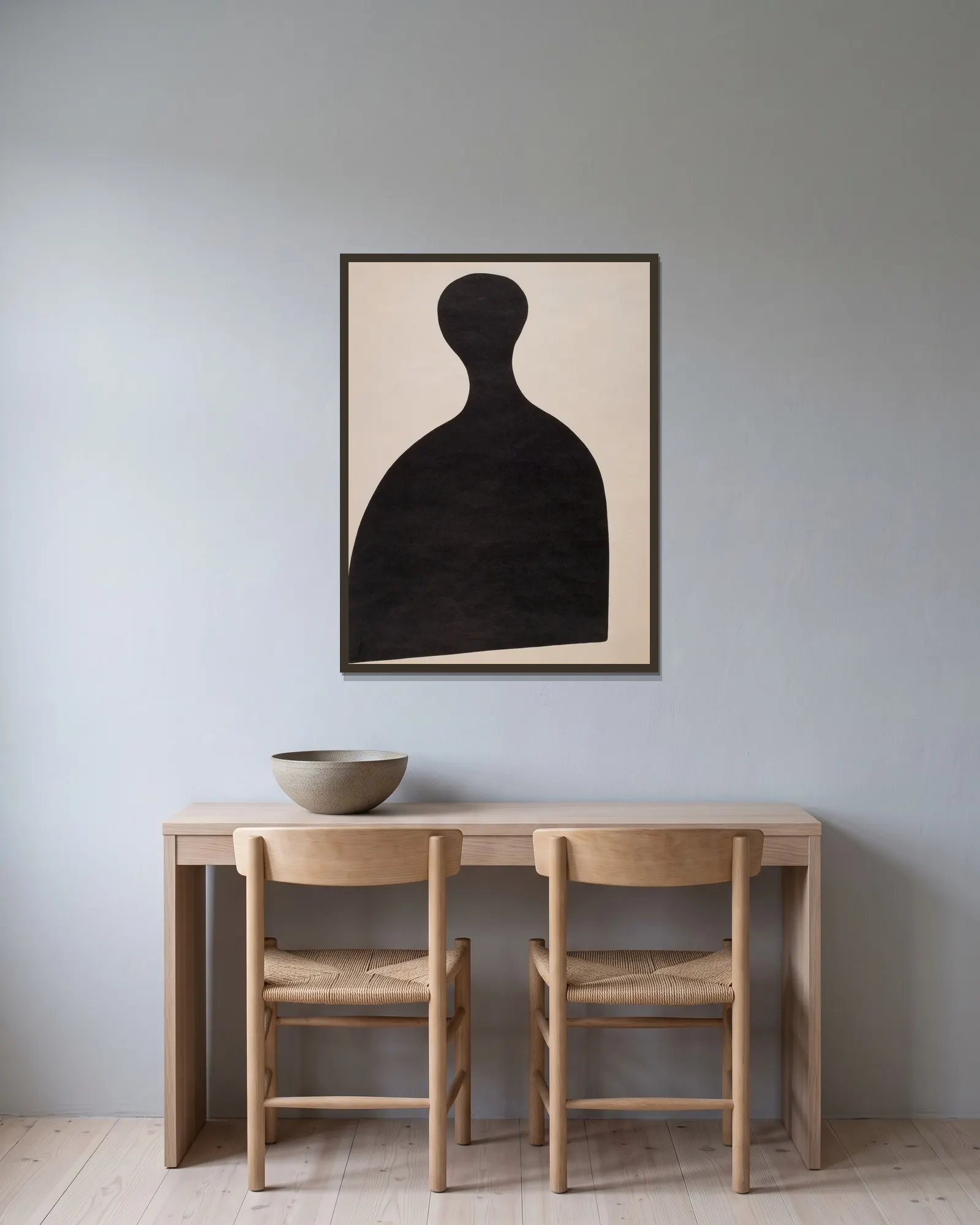 Eierschläger av Kurt Schwitters inramad på en vägg