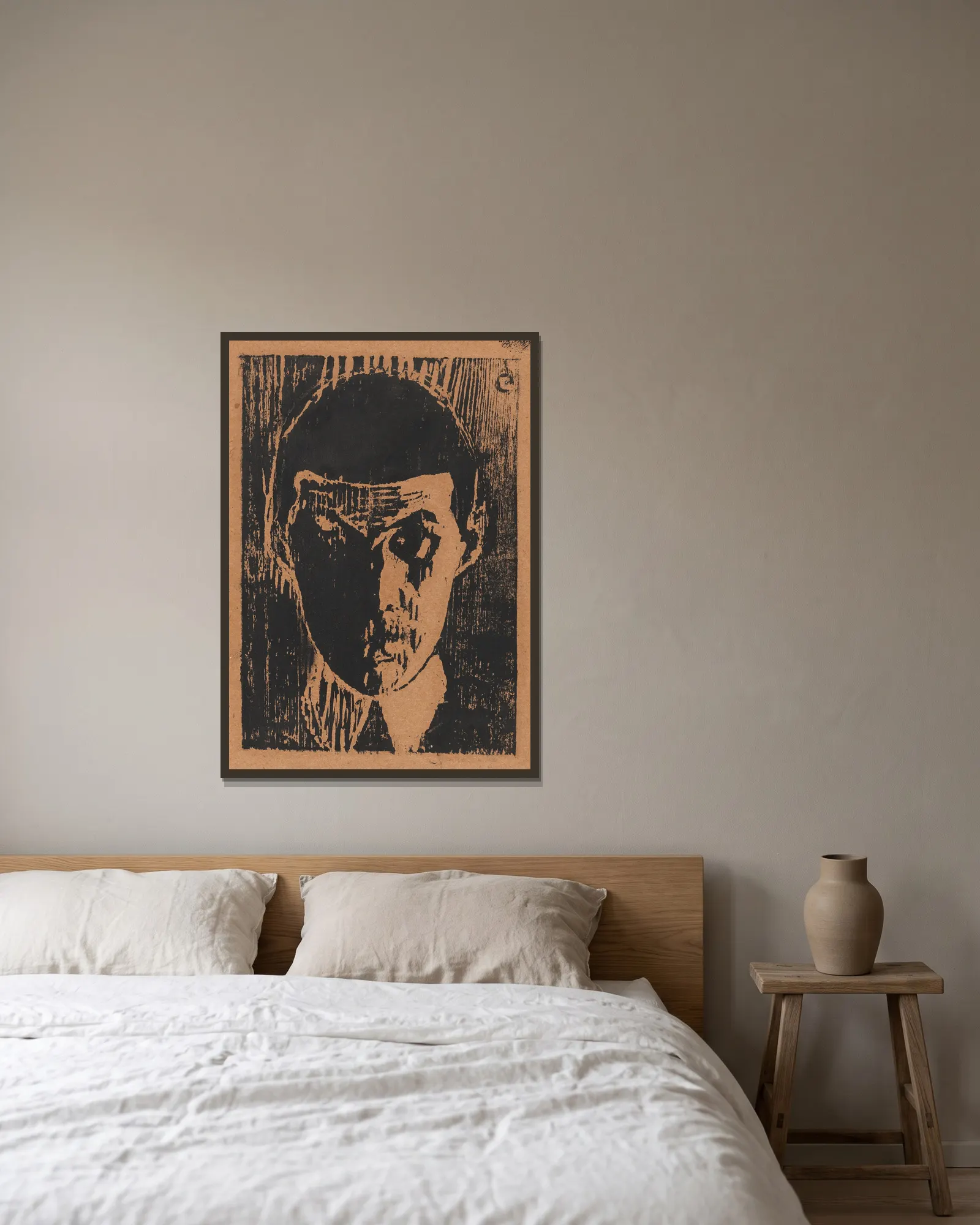 Selvportrett av Ludvig Karsten inramad på en vägg
