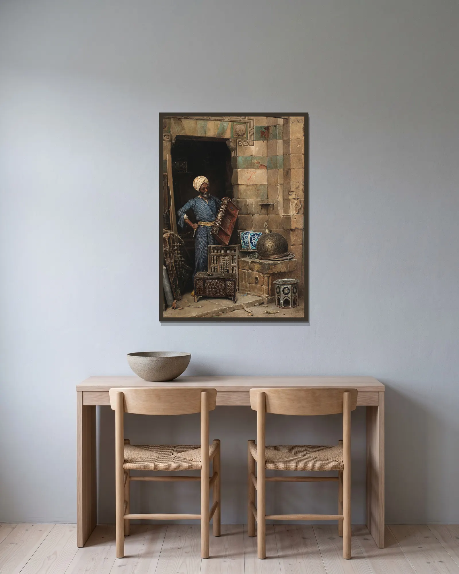 The Woodworker av Ludwig Deutsch inramad på en vägg