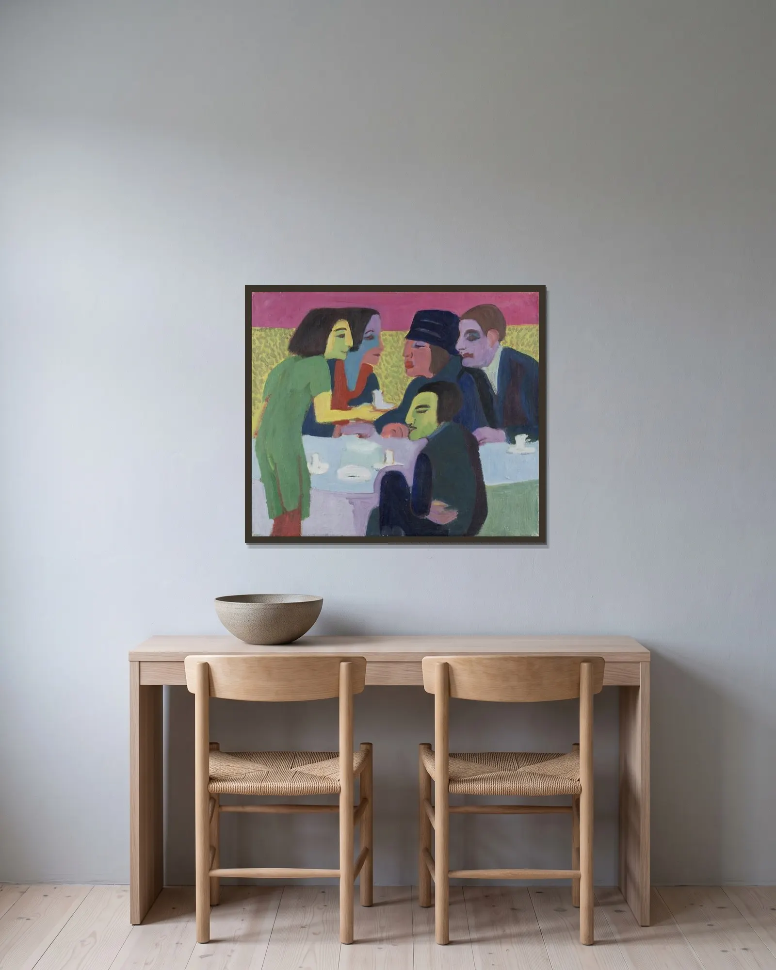 Scene at a Café av Ernst Ludwig Kirchner inramad på en vägg
