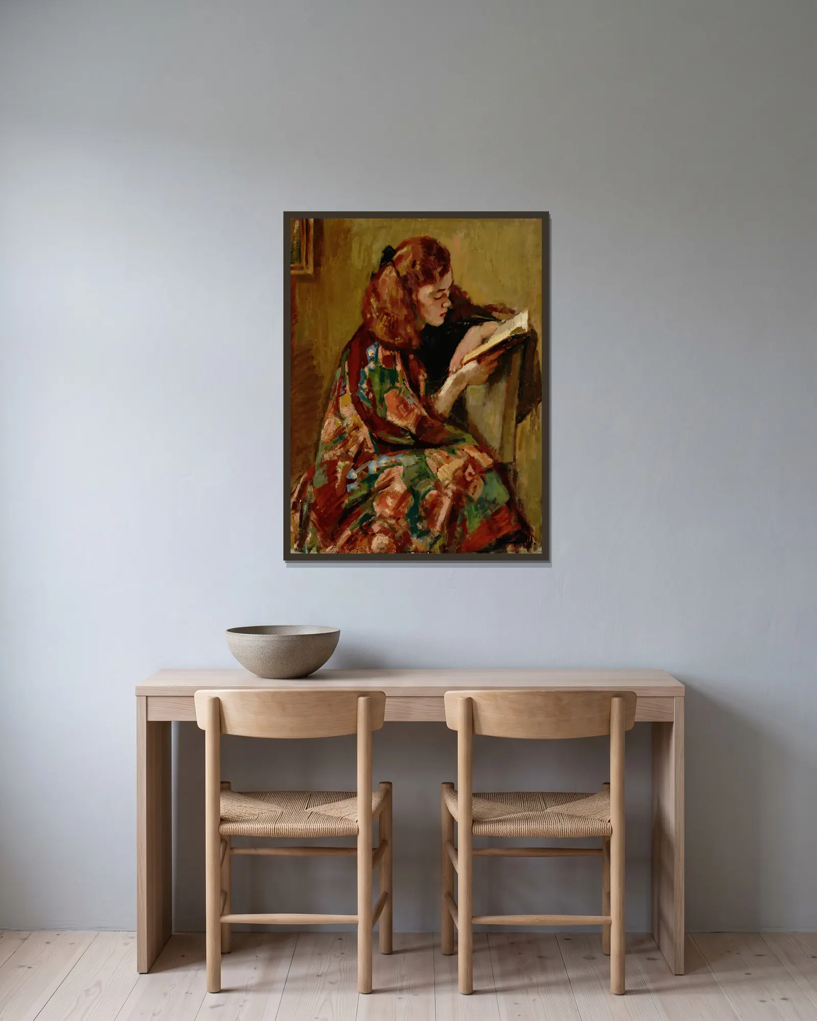 Girl Reading av Magnus Enckell inramad på en vägg