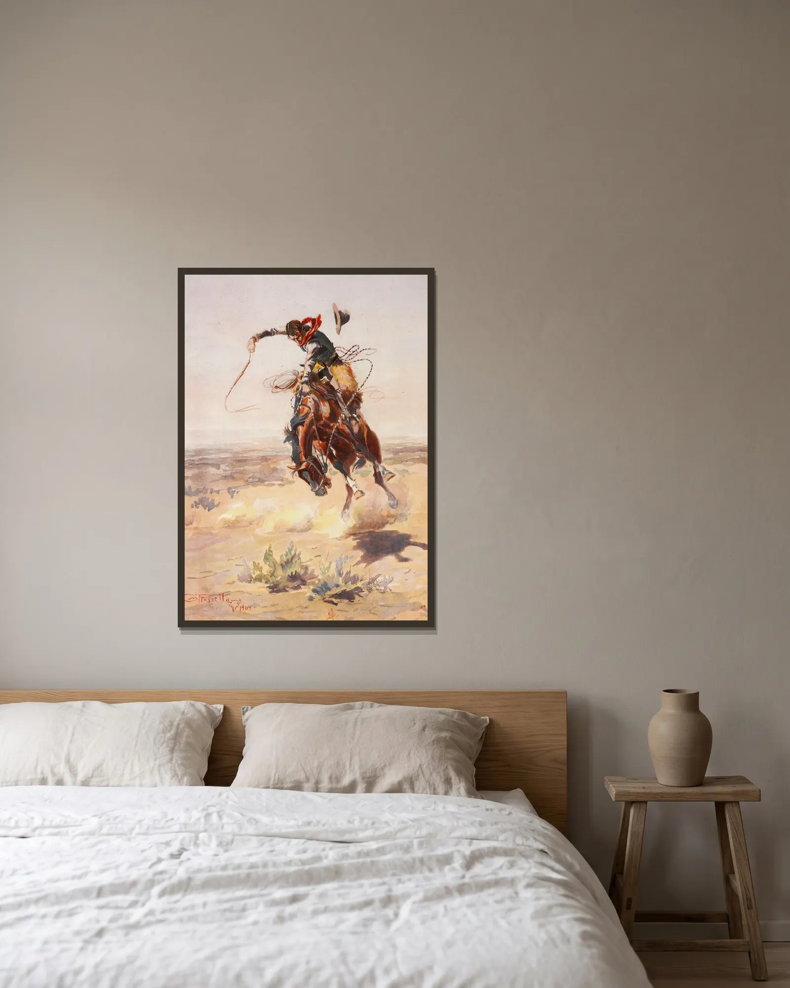 A bad hoss av Charles Marion Russell inramad på en vägg