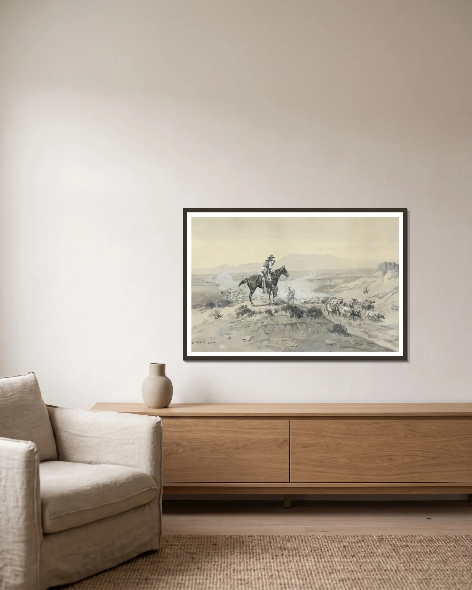 Trail Boss av Charles Marion Russell inramad på en vägg