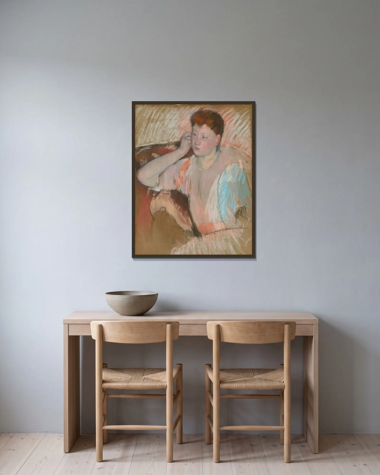 Clarissa av Mary Cassatt inramad på en vägg