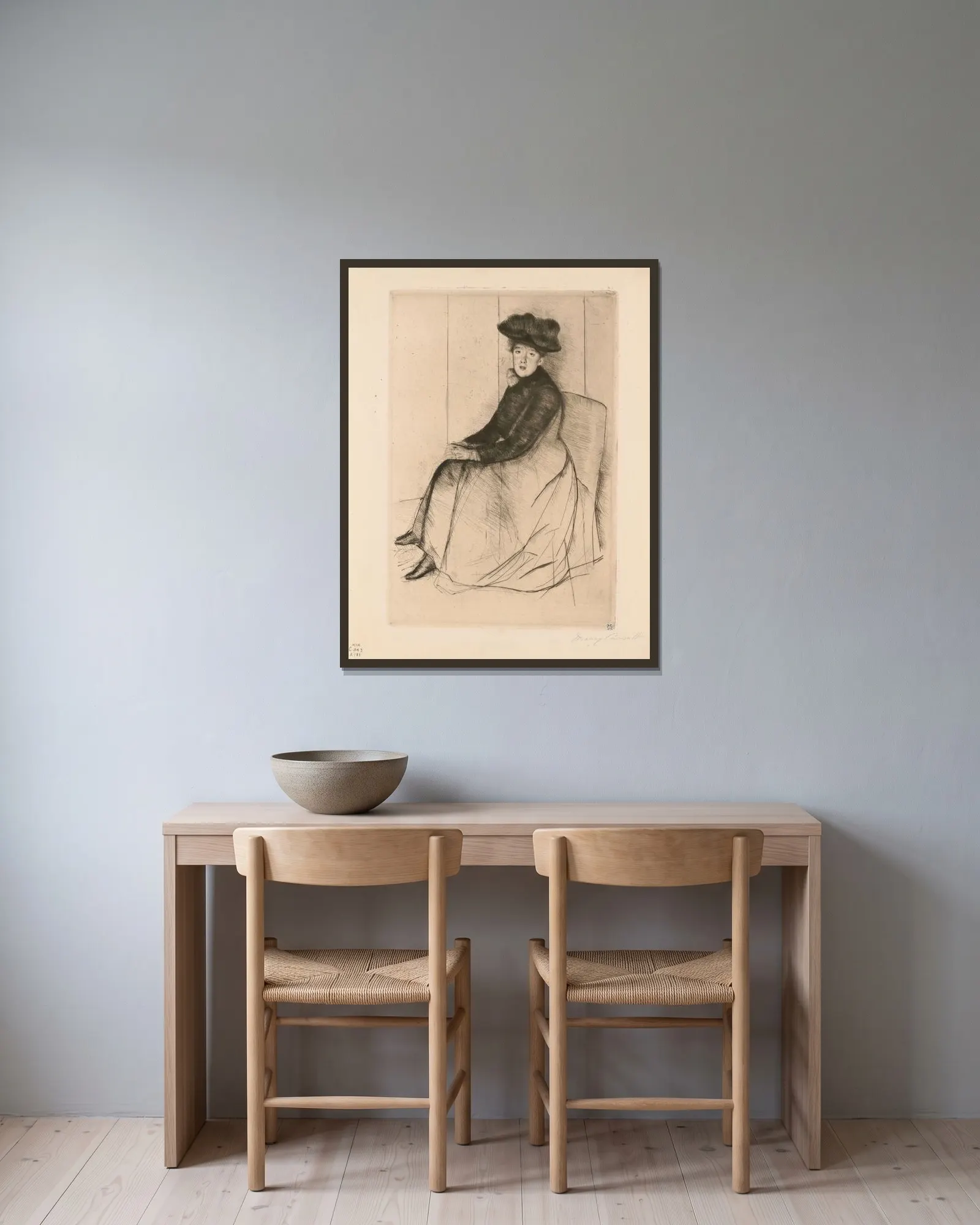 Reflection av Mary Cassatt inramad på en vägg