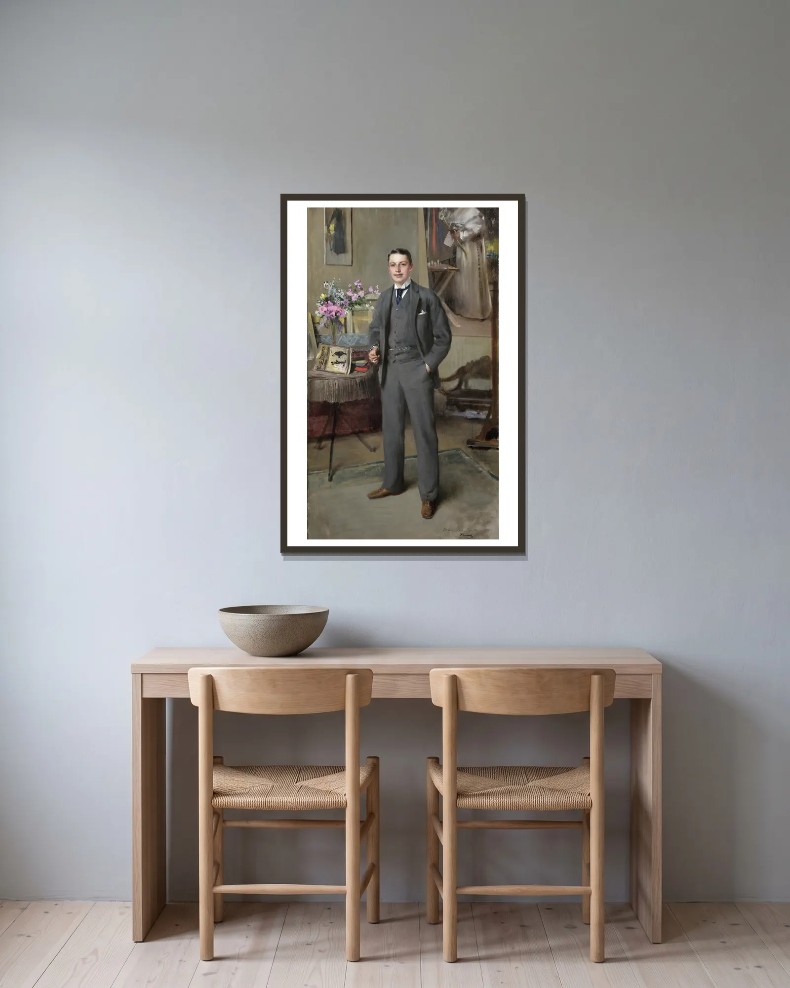 Herrenportrait av Vittorio Matteo Corcos inramad på en vägg