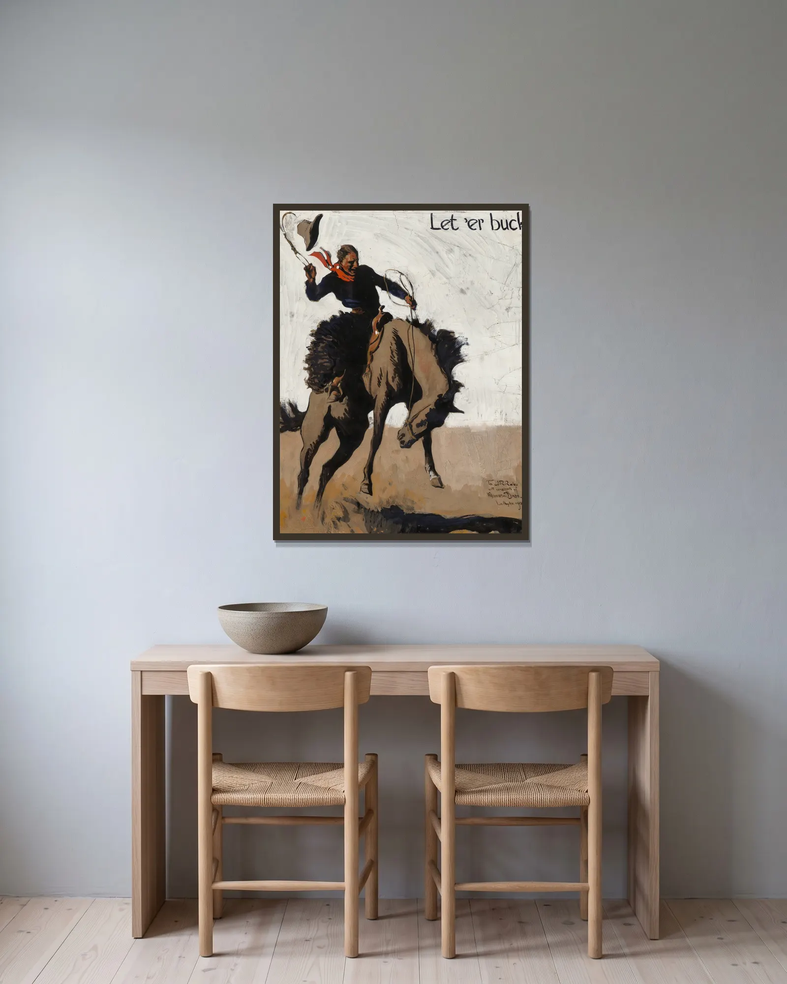 Let ‘er Buck! Pendleton Round Up av Maynard Dixon inramad på en vägg
