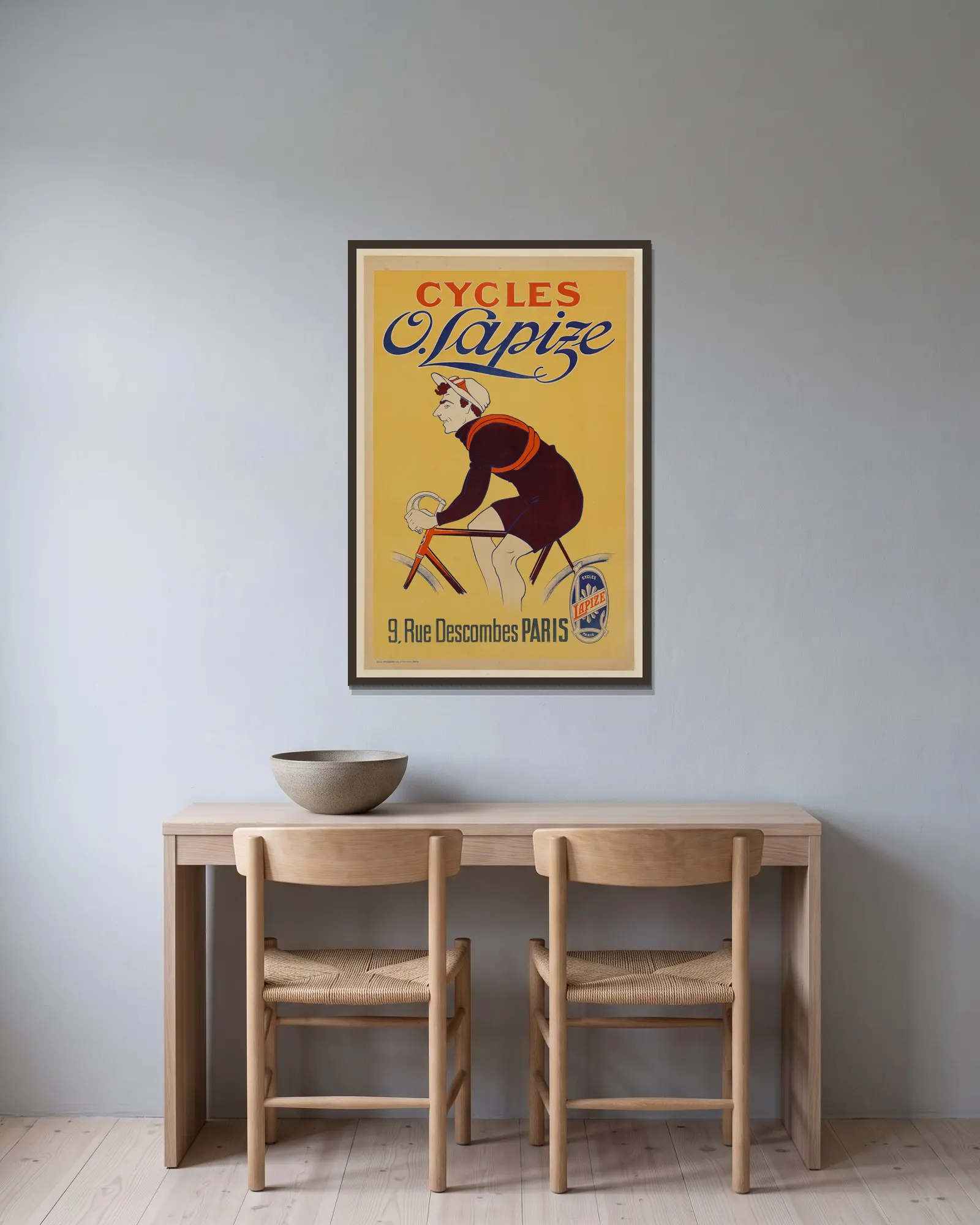 Cycles O. Lapize av Mich (Michel Liebeaux) inramad på en vägg