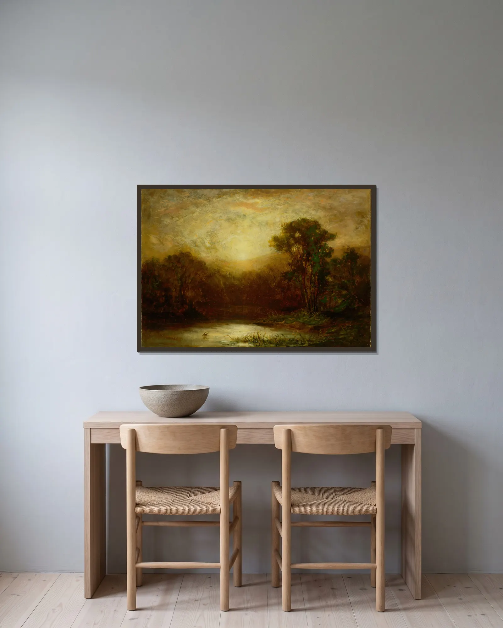 Sunset av Edward Mitchell Bannister inramad på en vägg