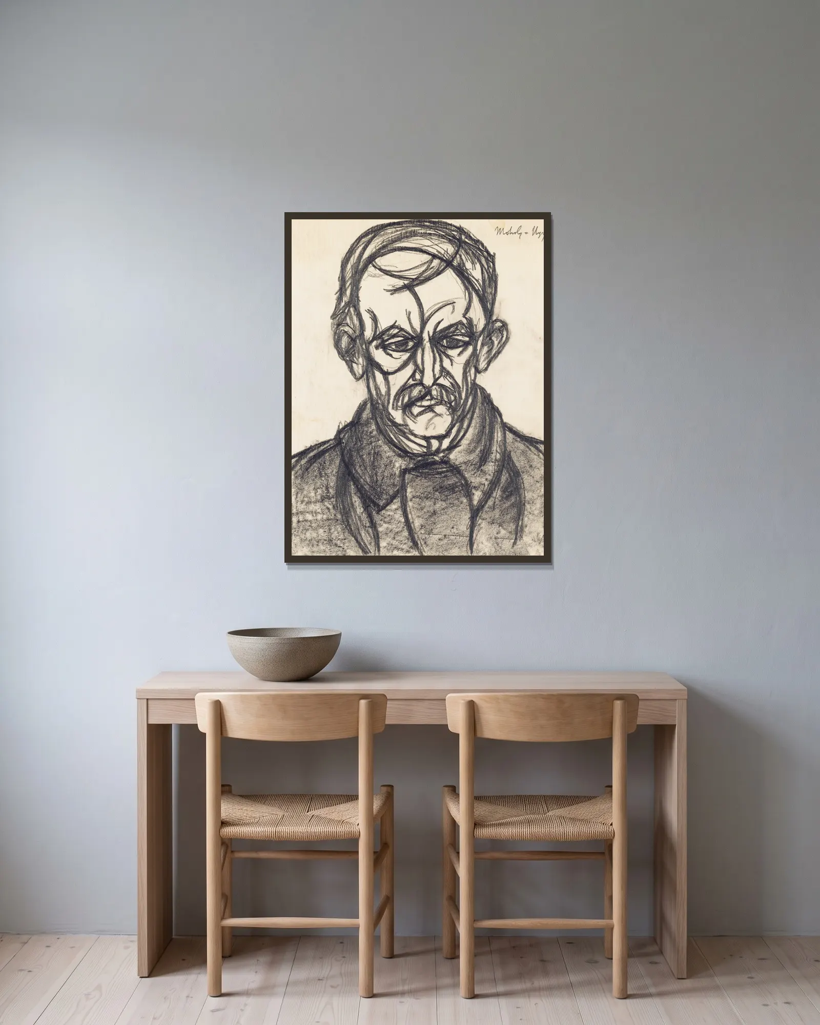 Porträt eines Mannes av László Moholy-Nagy inramad på en vägg