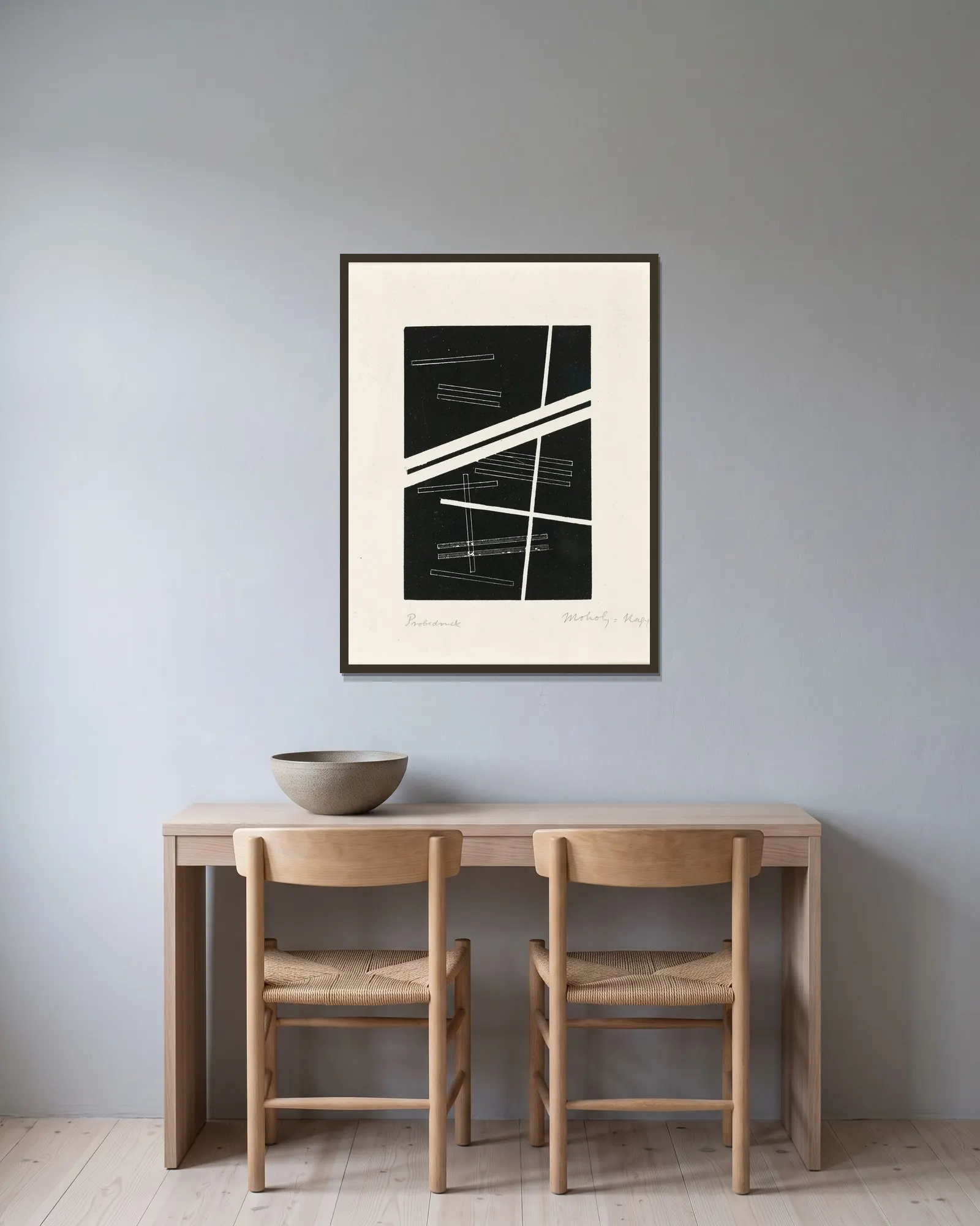 Untitled composition av László Moholy-Nagy inramad på en vägg