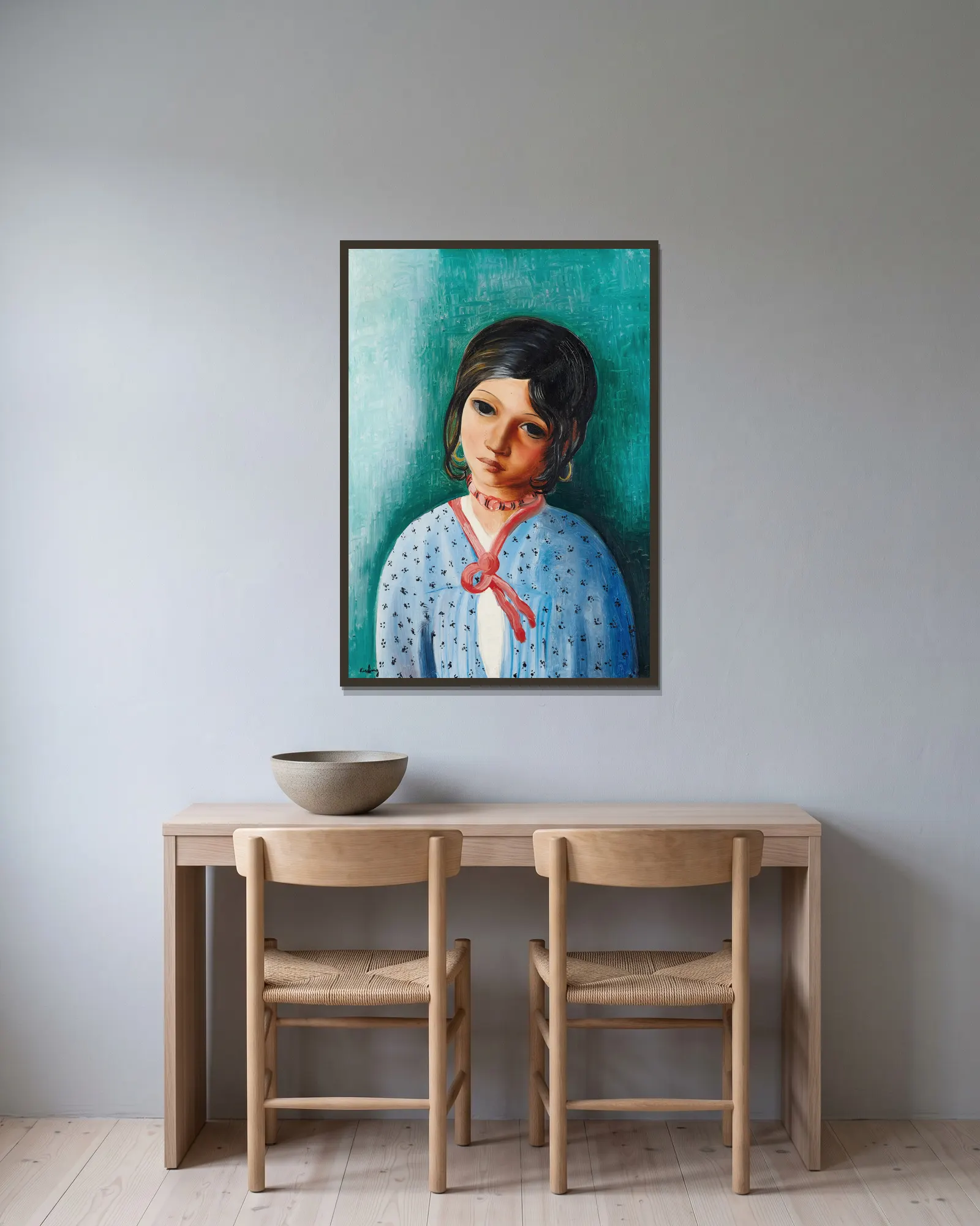 Portrait d’une enfant av Moïse Kisling inramad på en vägg