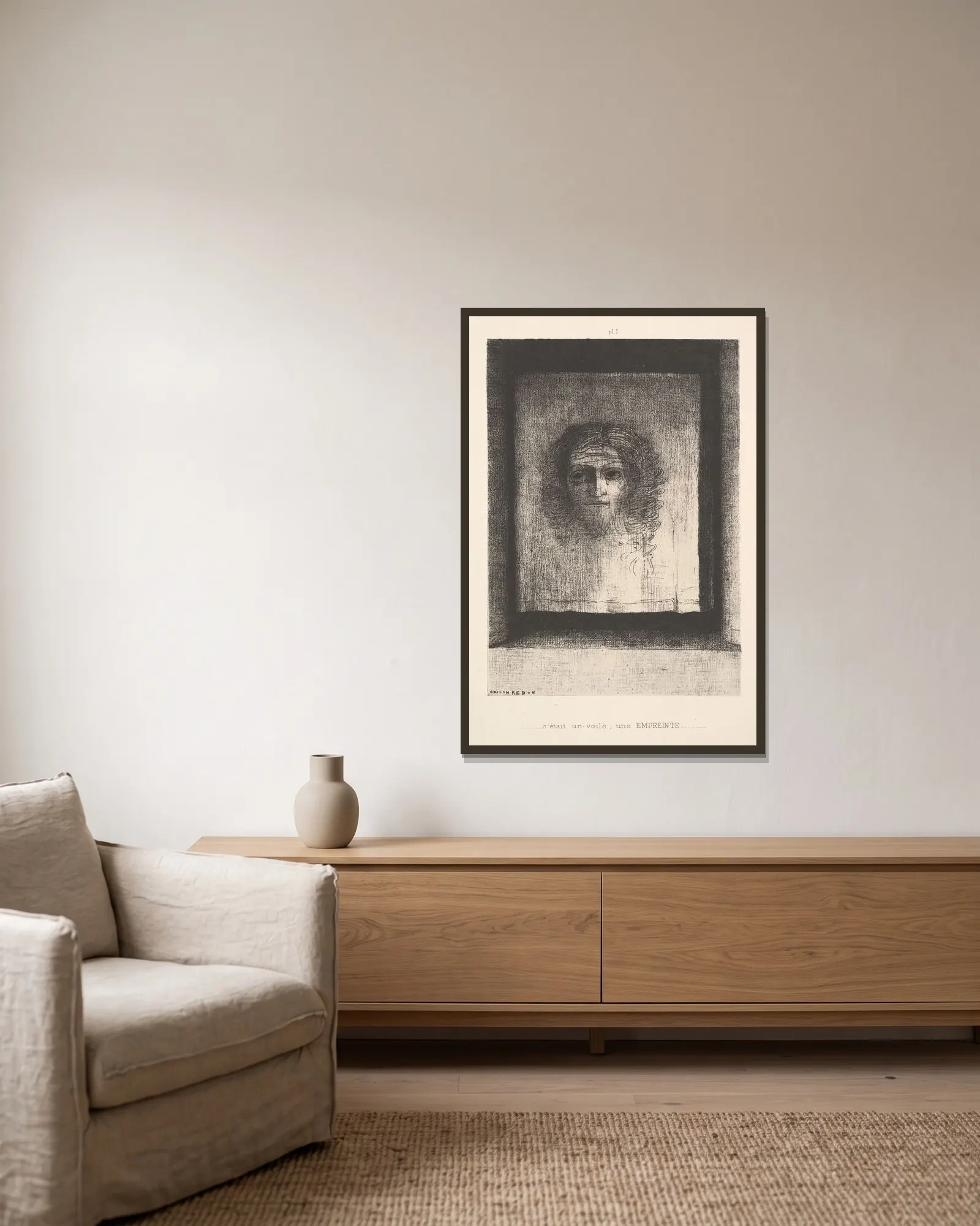 A Veil, a Printed Image av Odilon Redon inramad på en vägg