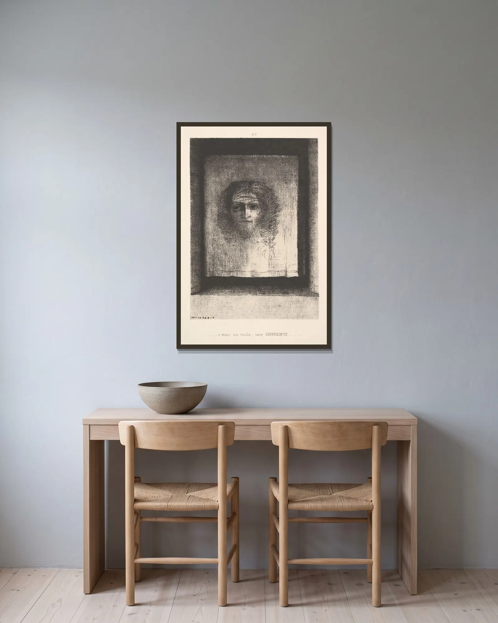 A Veil, a Printed Image av Odilon Redon inramad på en vägg