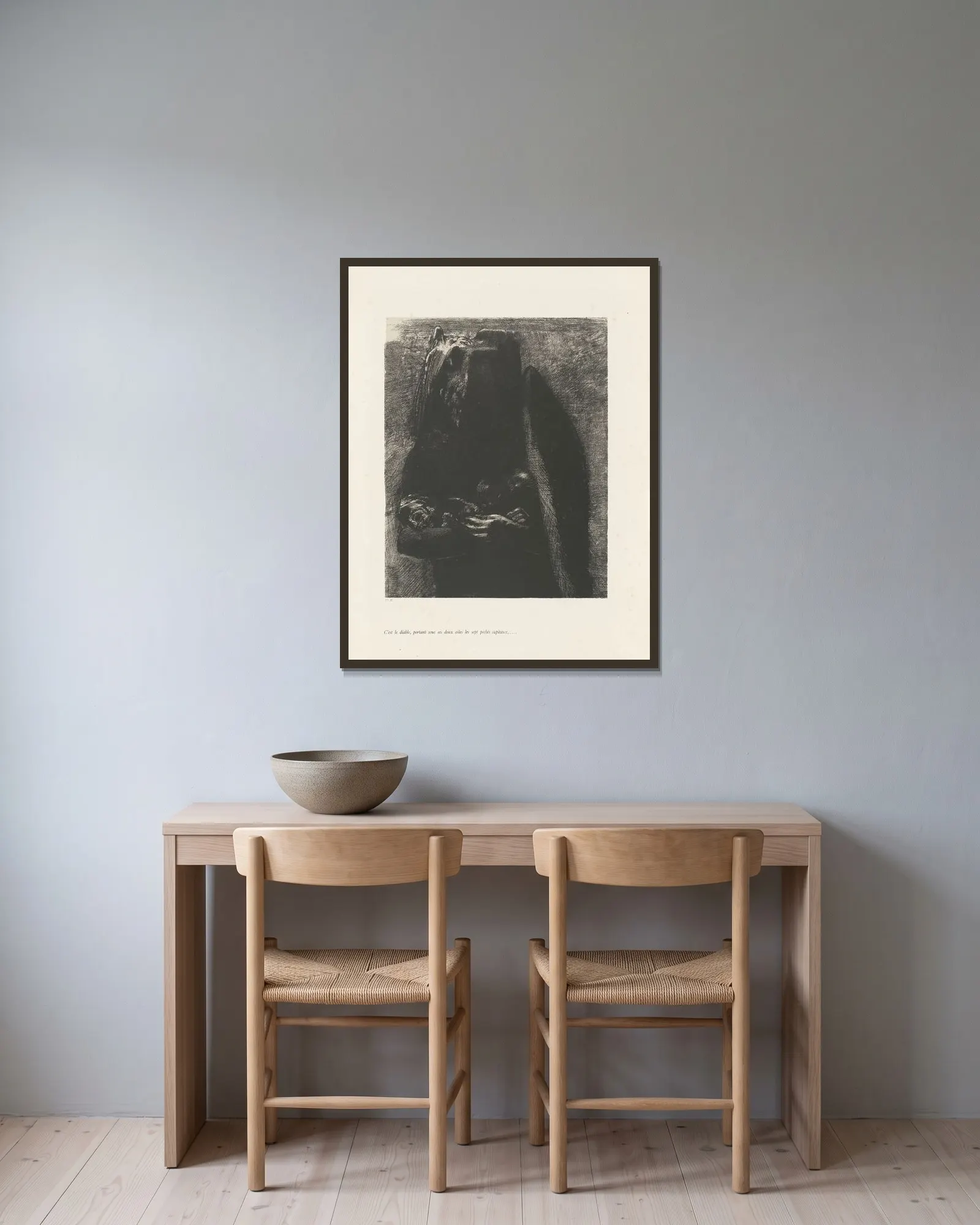 C’est le Diable av Odilon Redon inramad på en vägg