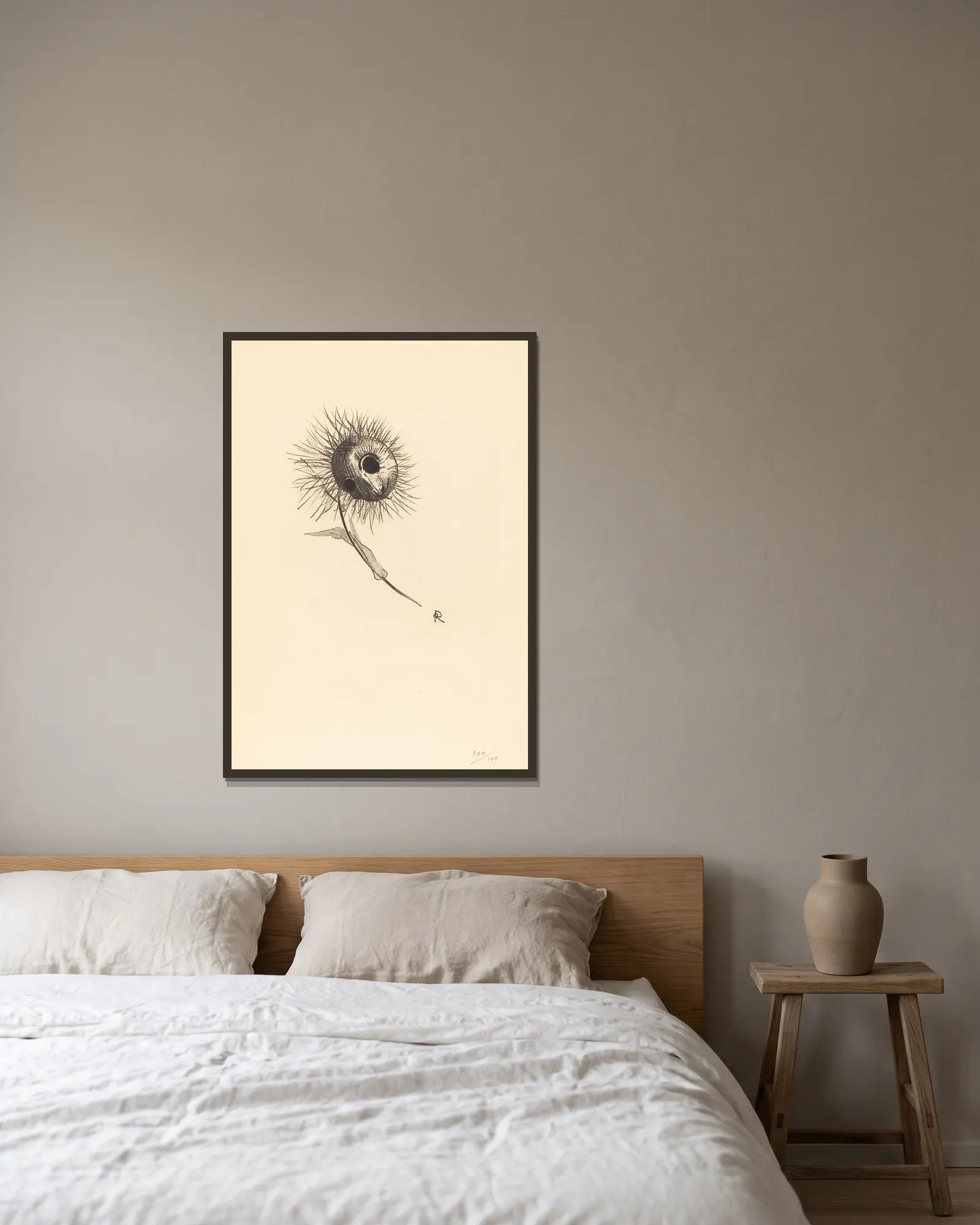 Cul-de-Lampe av Odilon Redon inramad på en vägg
