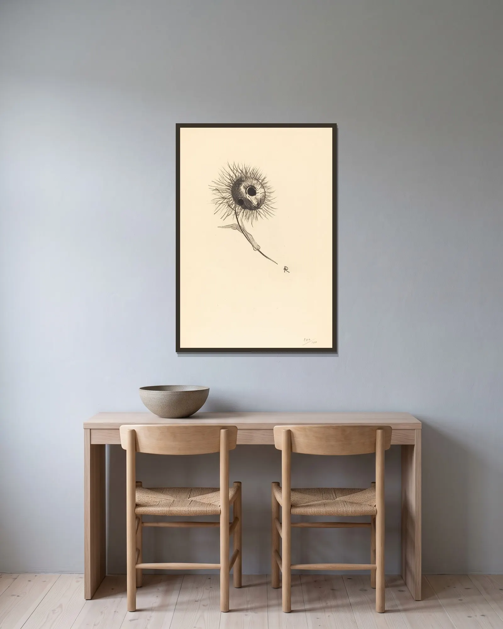 Cul-de-Lampe av Odilon Redon inramad på en vägg