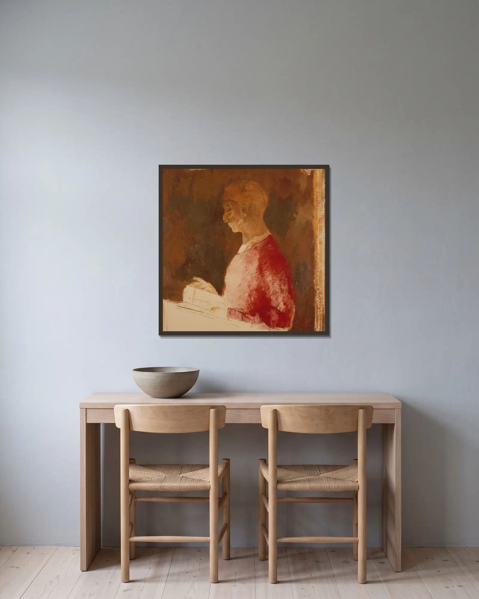 Le Graveur av Odilon Redon inramad på en vägg