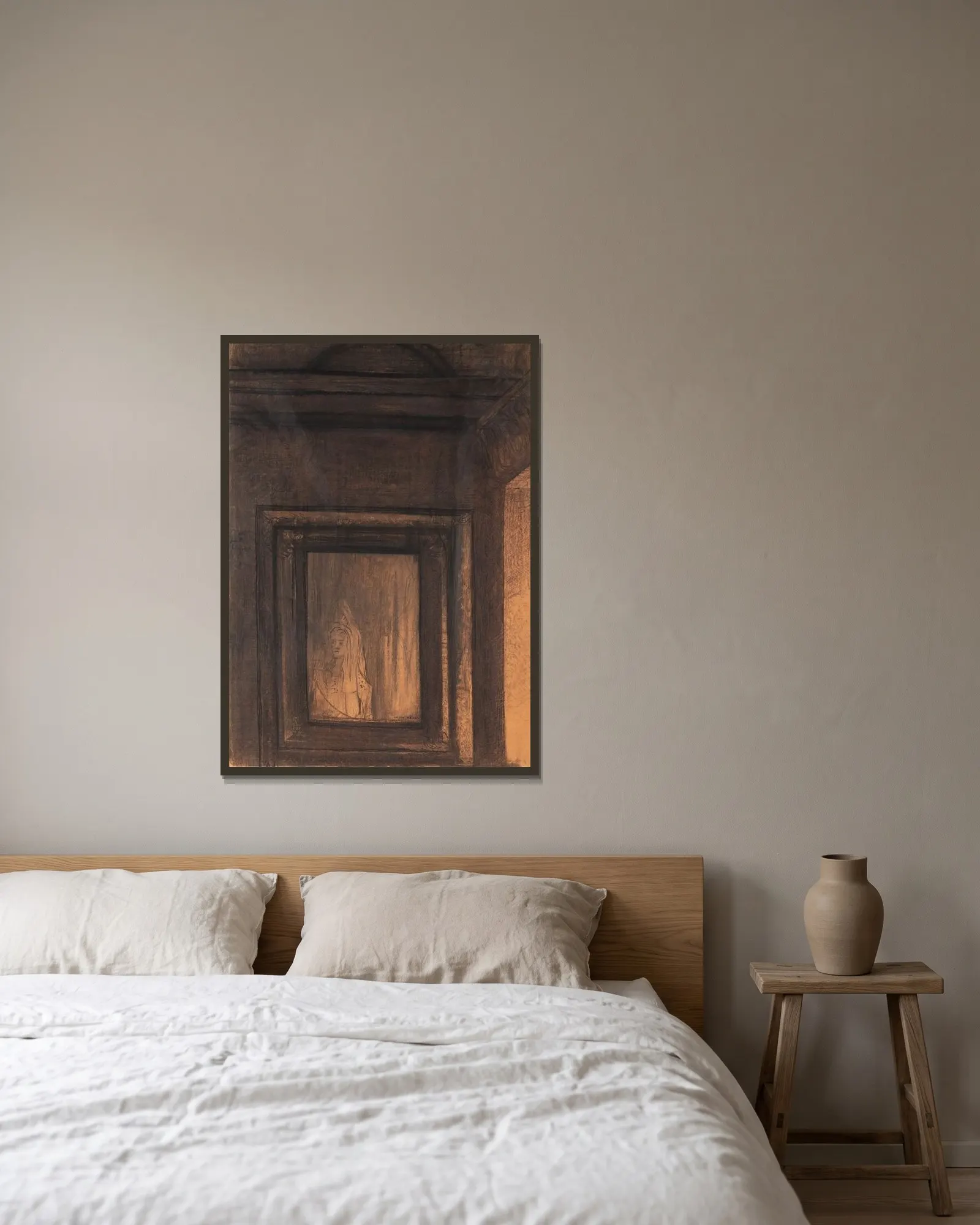 Le Miroir hanté av Odilon Redon inramad på en vägg