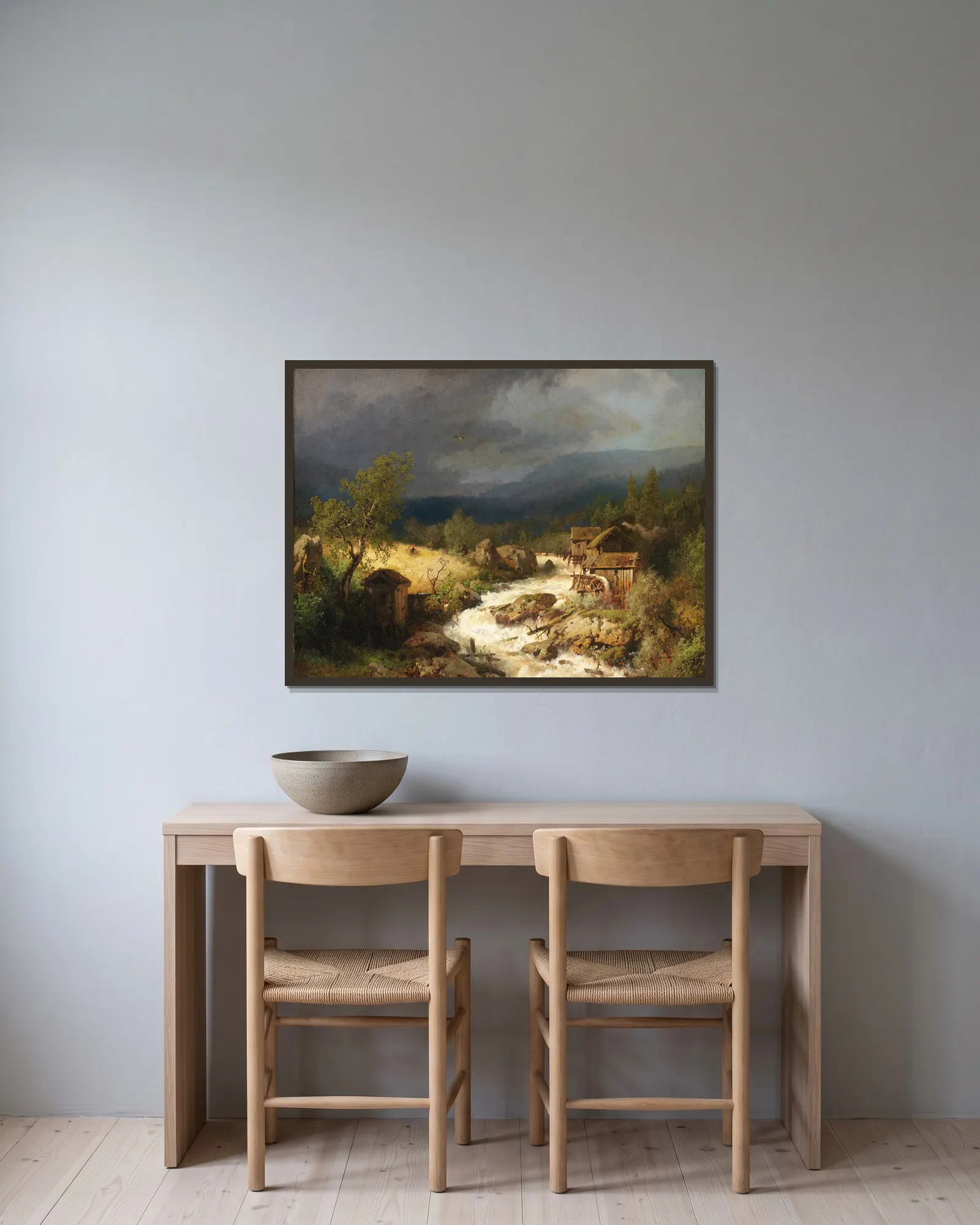 Mill on a Torrent av Hermann Ottomar Herzog inramad på en vägg