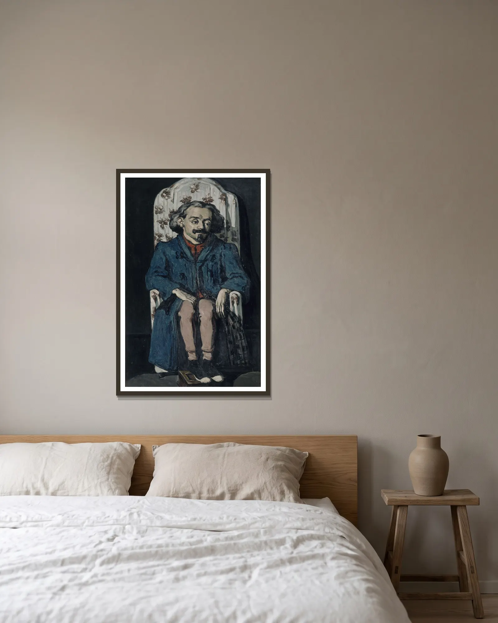 Achille Emperaire av Paul Cézanne inramad på en vägg
