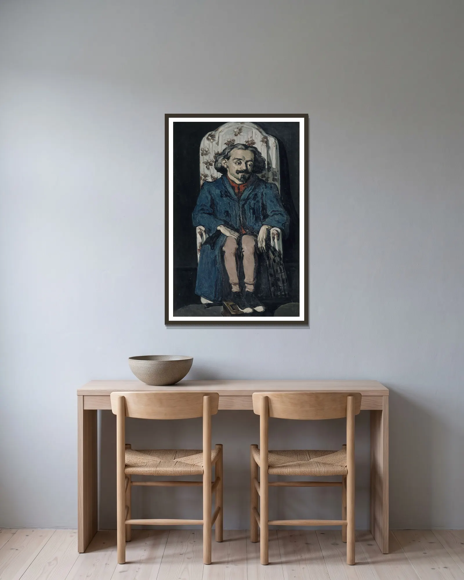 Achille Emperaire av Paul Cézanne inramad på en vägg