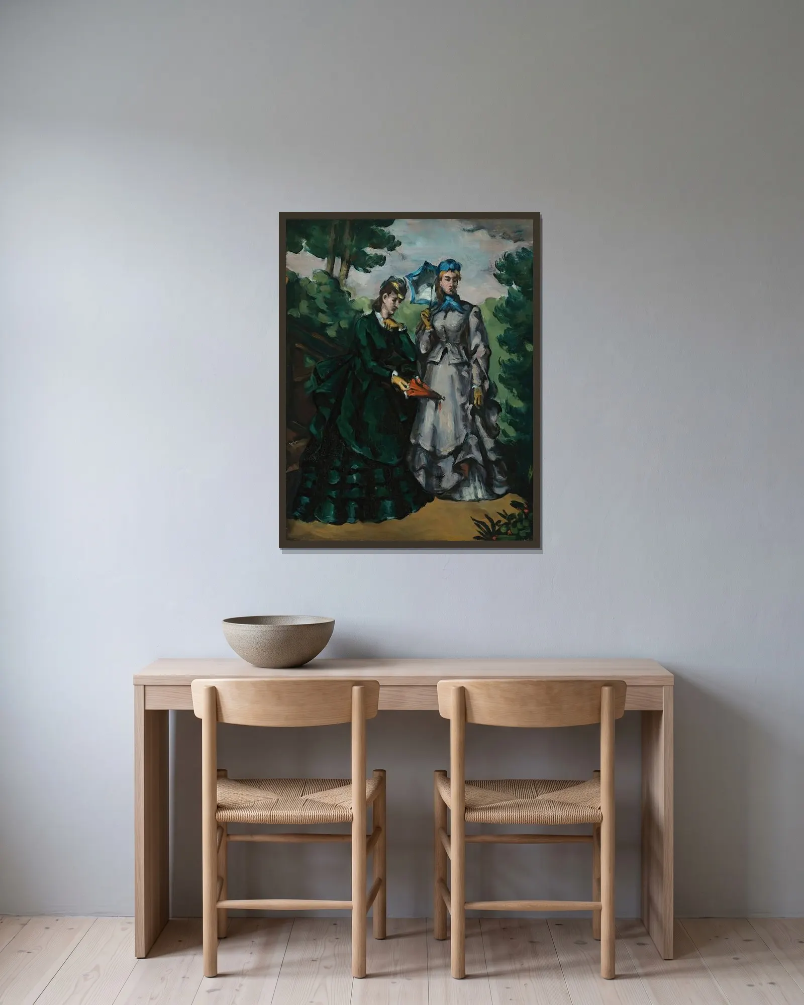 La Promenade av Paul Cézanne inramad på en vägg